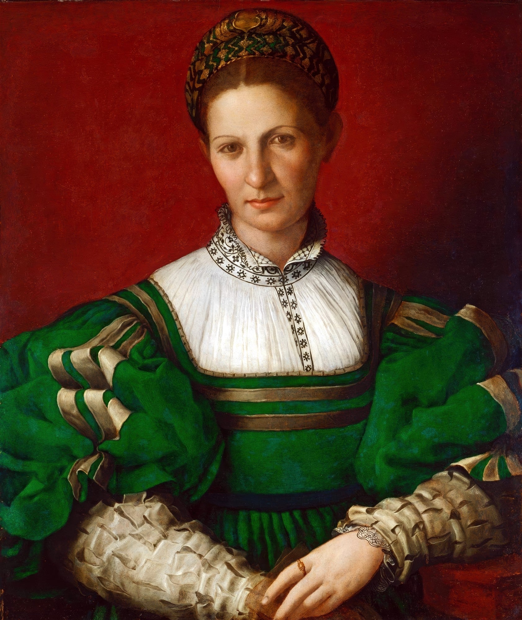 Retrato renascentista de uma dama com vestes verdes e touca dourada, em fundo vermelho, atribuído a Bronzino.