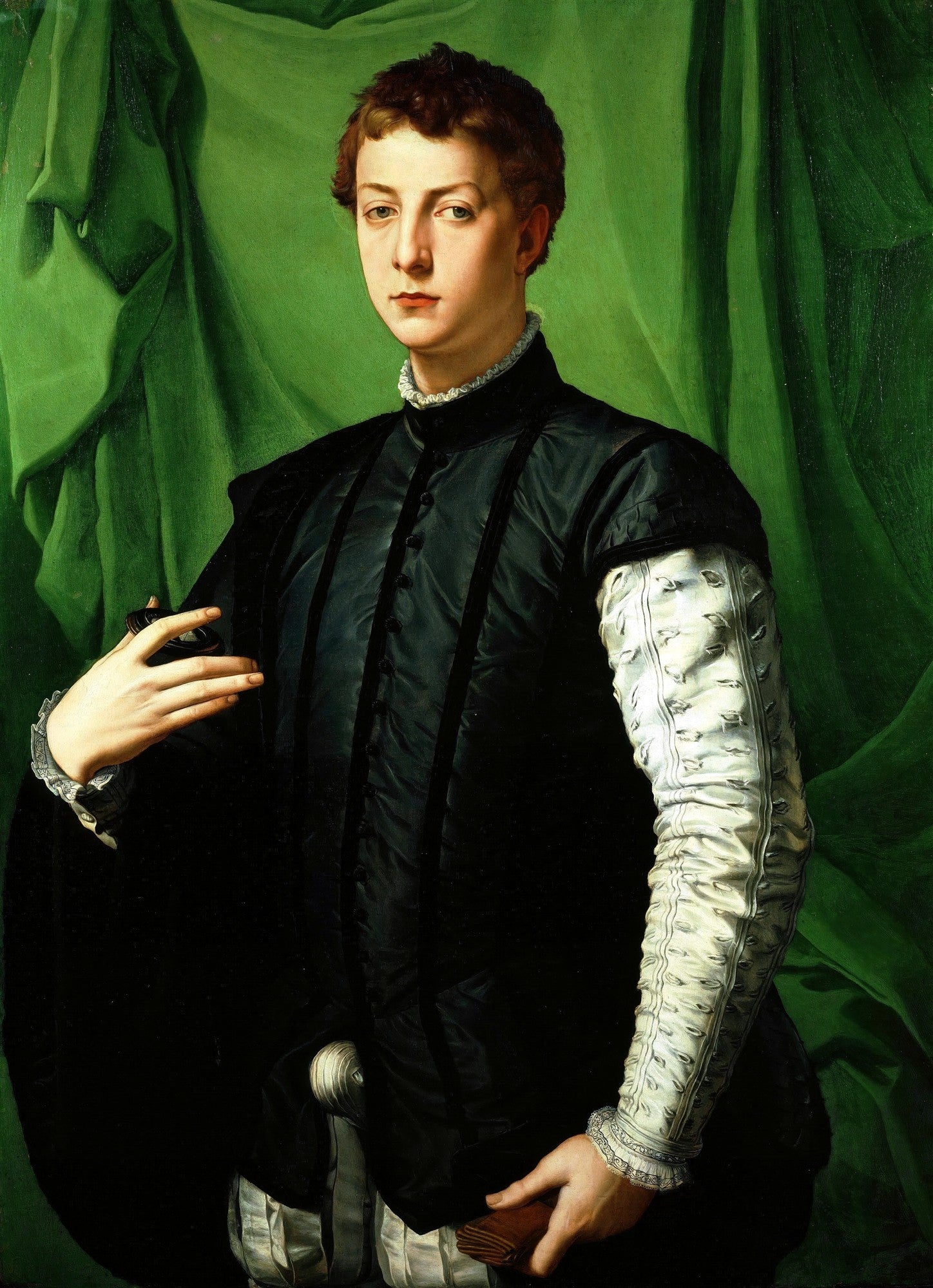 Retrato de um jovem, obra de Agnolo Bronzino, com vestes escuras e luxuosas contra um fundo verde vibrante. O jovem tem um olhar sereno e enigmático.