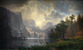 Quadro decorativo paisagem montanhosa com lago, cachoeiras e cervos, sob luz dourada e céu nublado, estilo Albert Bierstadt.