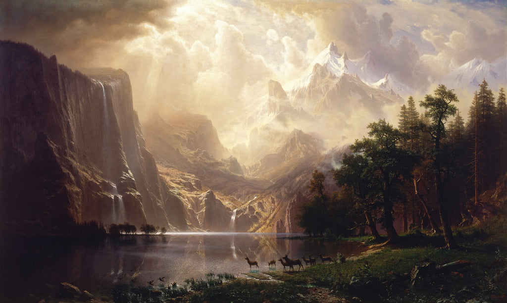 Pintura a óleo de Albert Bierstadt, mostrando um vale montanhoso vasto com um lago, cachoeiras, nuvens douradas e cervos à beira da água, com montanhas nevadas ao fundo e florestas densas nas laterais.