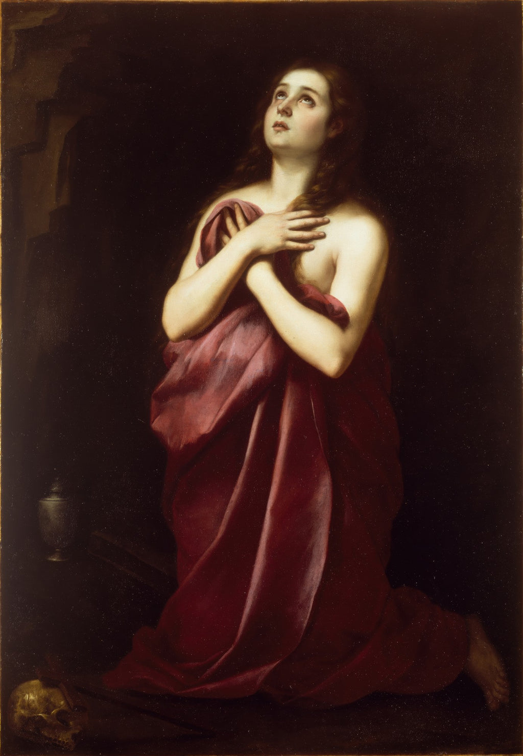 Quadro decorativo mostrando Maria Madalena ajoelhada, olhando para cima com expressão de súplica e arrependimento. Ela está parcialmente coberta por um drapeado vermelho, com um fundo escuro. Um vaso e um crânio são visíveis no canto inferior esquerdo.