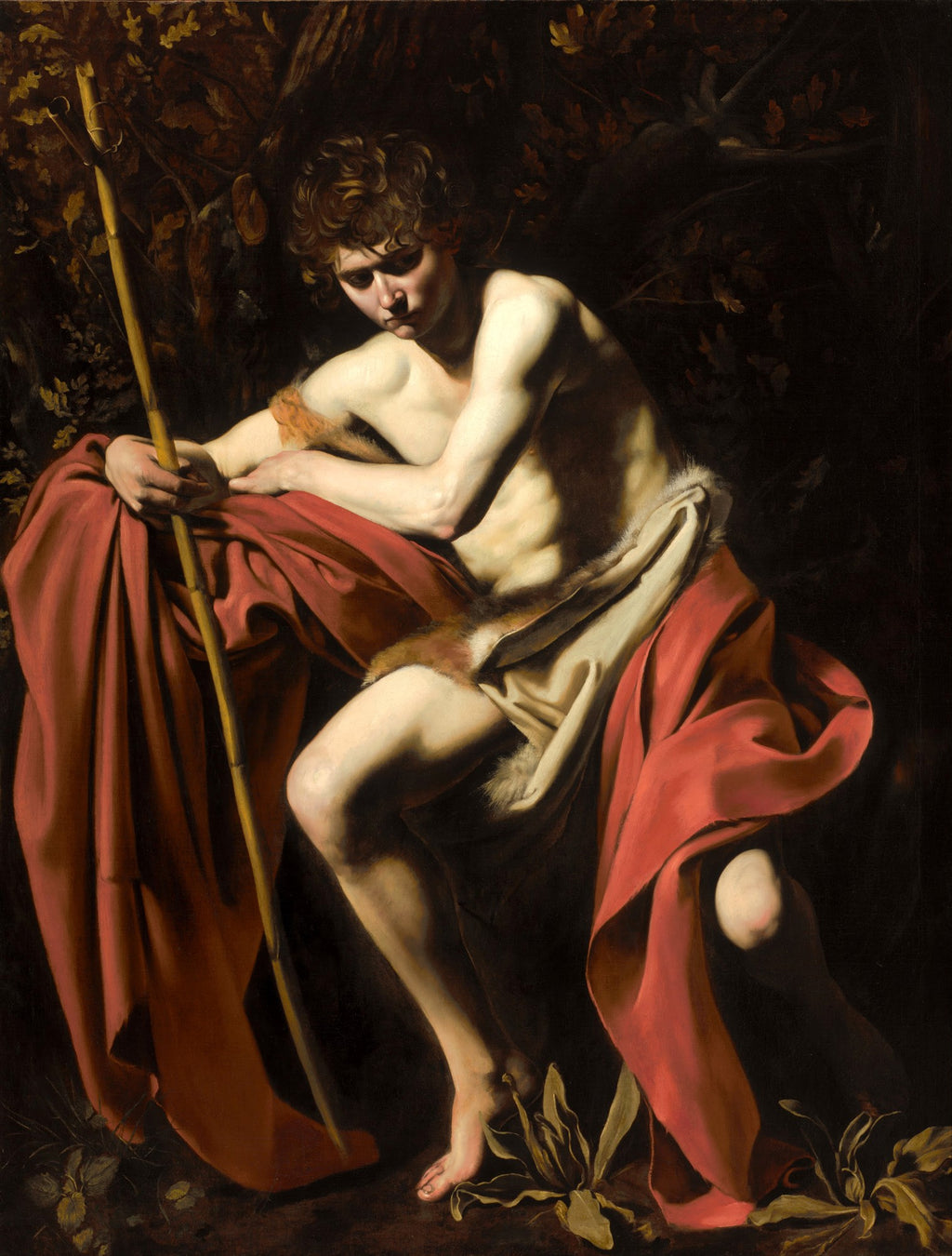 Quadro decorativo do São João Batista de Caravaggio, jovem nu com manto vermelho e cajado em cenário escuro e dramático.