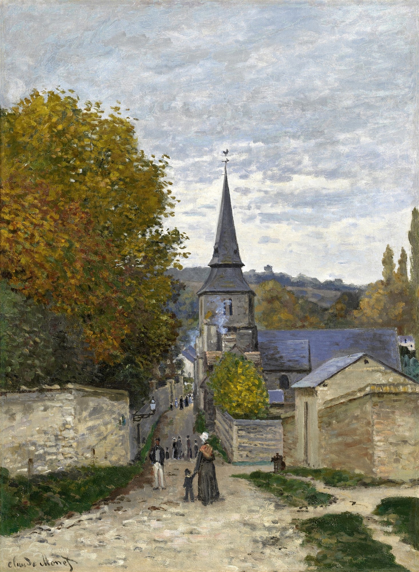 Quadro decorativo "A Igreja de Vétheuil" de Claude Monet, mostrando uma igreja de pedra com torre pontiaguda, rodeada por árvores de folhagem outonal e um céu nublado, com figuras caminhando em uma rua de paralelepípedos. Cena de vilarejo francês.