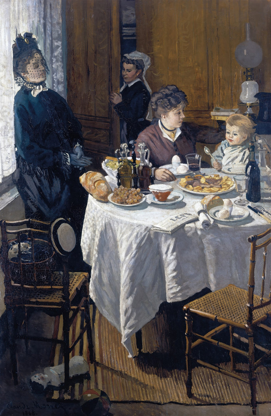 Quadro decorativo 'O Almoço' de Claude Monet, representando uma família em uma refeição íntima, com luz natural entrando pela janela. Mulheres e uma criança sentadas à mesa com louças, pães e frutas.