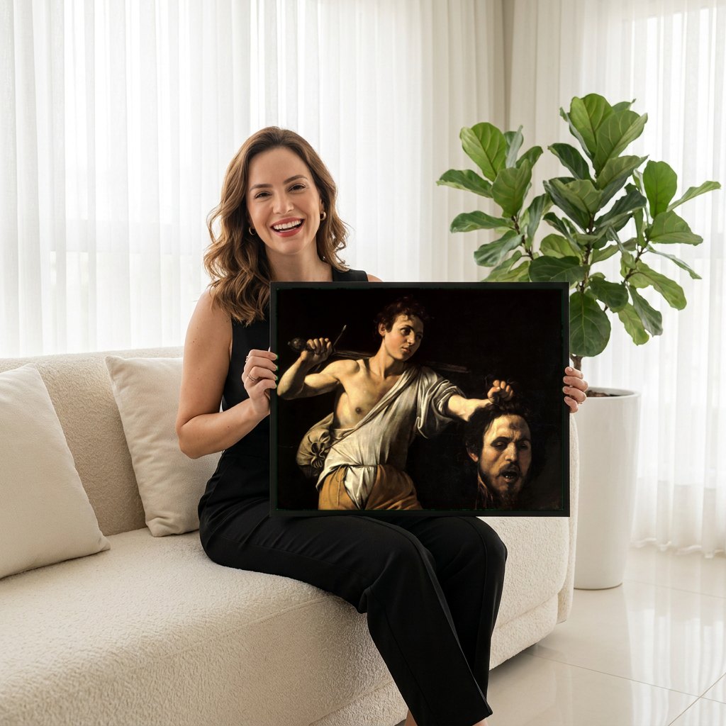 Quadro Decorativo David com a Cabeça de Golias - Caravaggio | modelo apresentando o quadro emoldurado