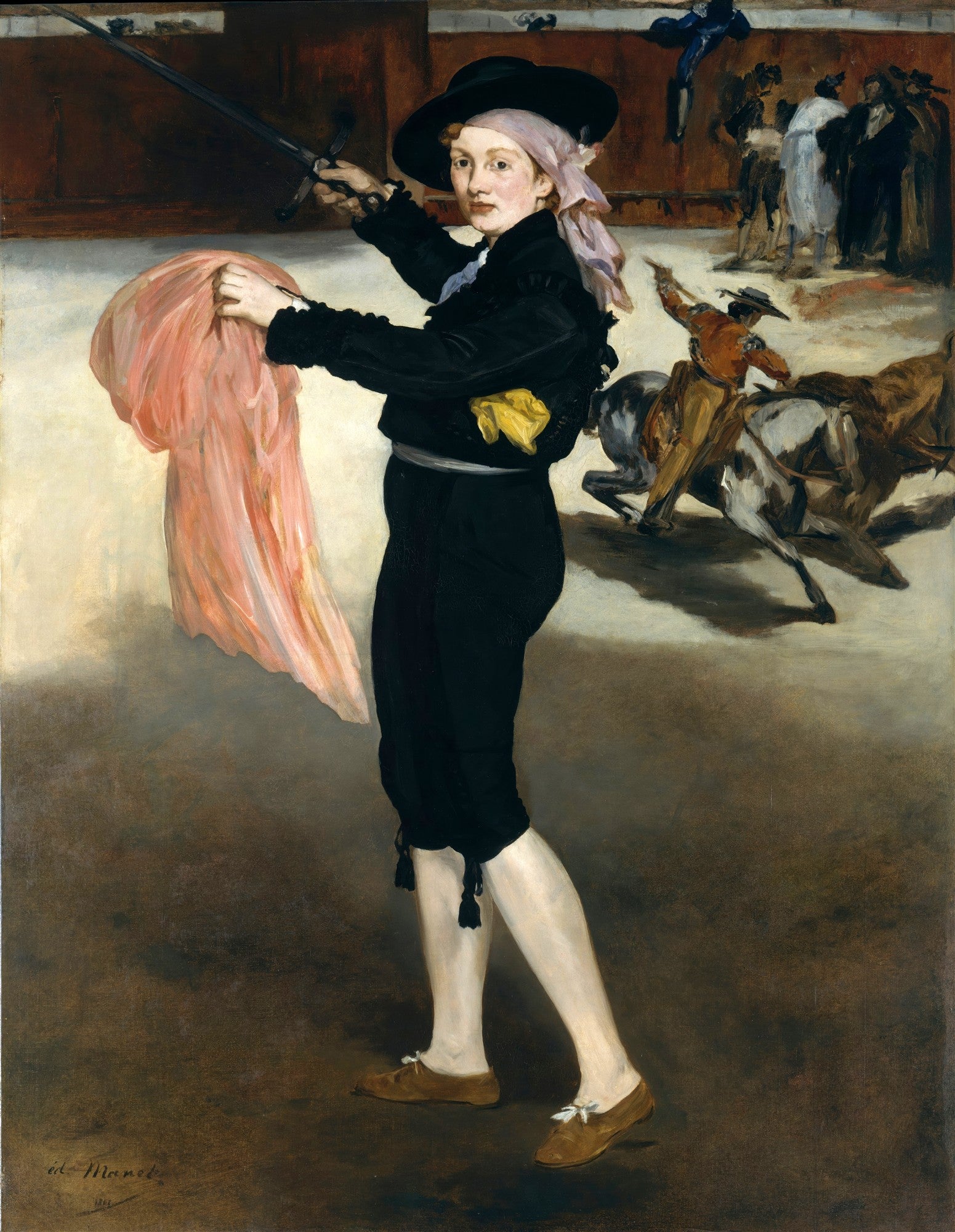 Quadro decorativo de Edouard Manet, 'A Toureira', mostrando uma mulher vestida de toureiro com chapéu preto, lenço rosa na cabeça, jaqueta preta e calças pretas, segurando um capote rosa e uma espada. Ao fundo, toureiros montados a cavalo em uma arena.