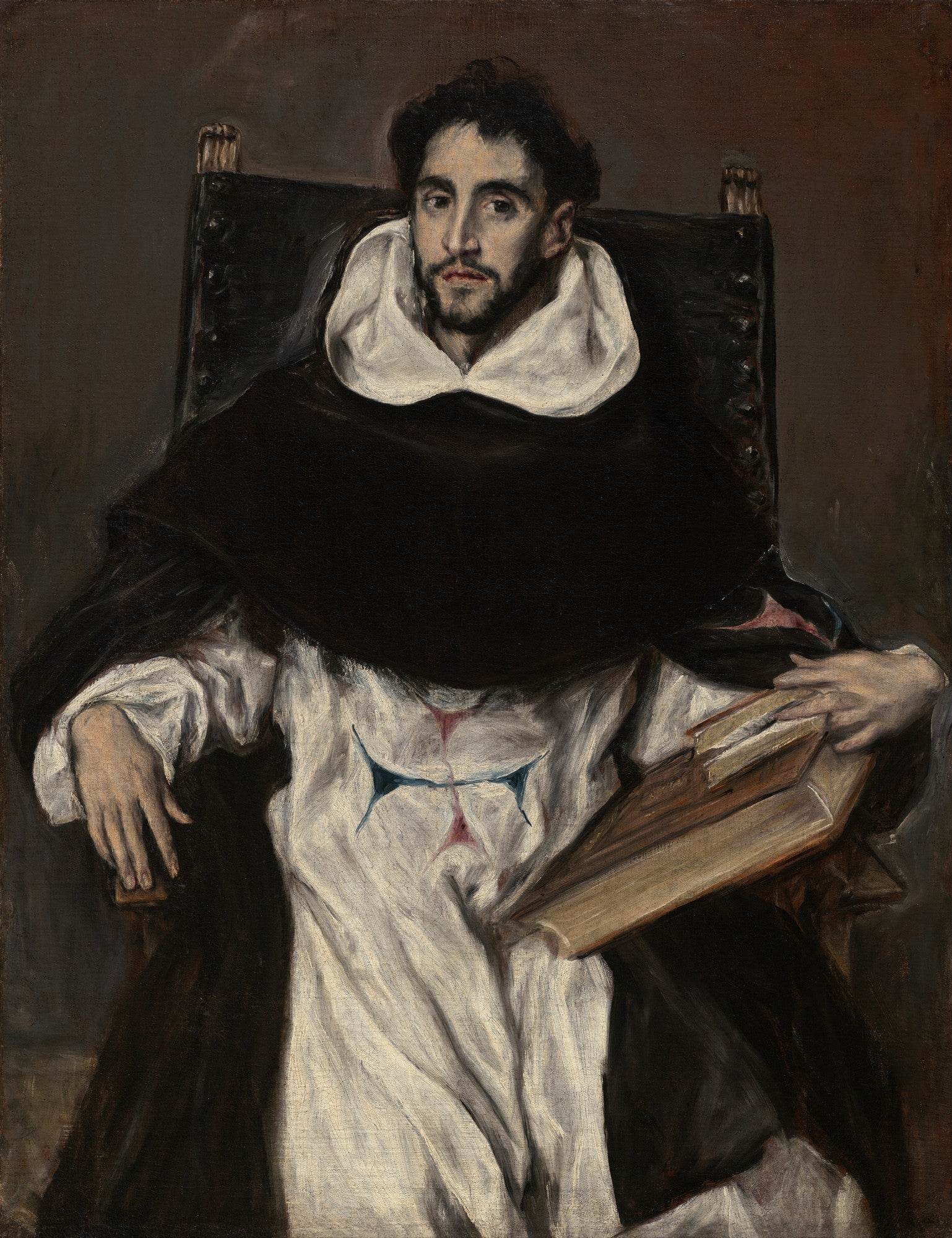 Retrato de São Tiago Menor por El Greco, um homem barbudo com túnica escura e gola branca, segurando um livro, sentado em uma cadeira de madeira.
