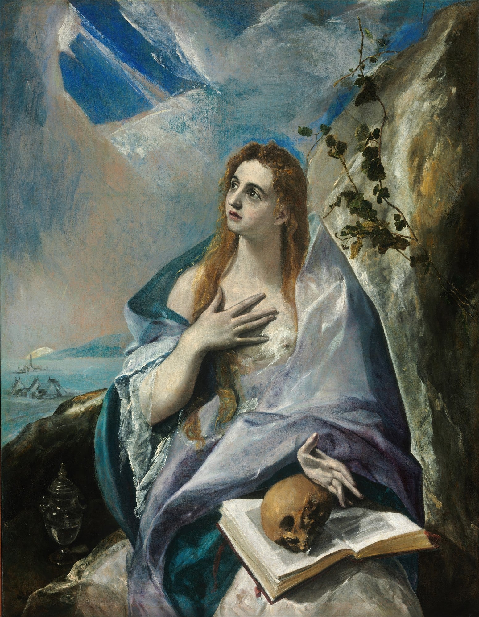 Pintura de El Greco, Madalena Penitente, retratando uma mulher com cabelos ruivos, vestida de azul e branco, olhando para cima com as mãos no peito, um crânio e um livro abertos em primeiro plano, montanhas e céu dramático ao fundo.