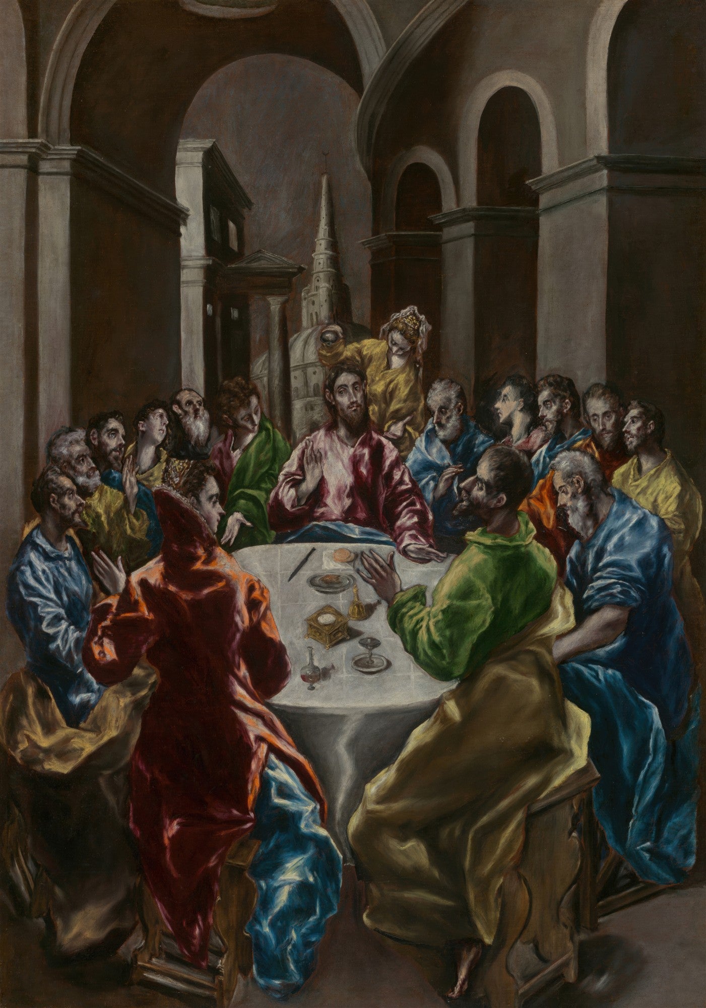 Quadro decorativo da Última Ceia de El Greco, mostrando Jesus Cristo e os doze apóstolos sentados ao redor de uma mesa, em um ambiente arquitetônico com arcos e uma torre ao fundo. As figuras possuem as características alongadas e dramáticas do estilo de El Greco, com vestes em tons vibrantes de vermelho, azul, verde e amarelo.