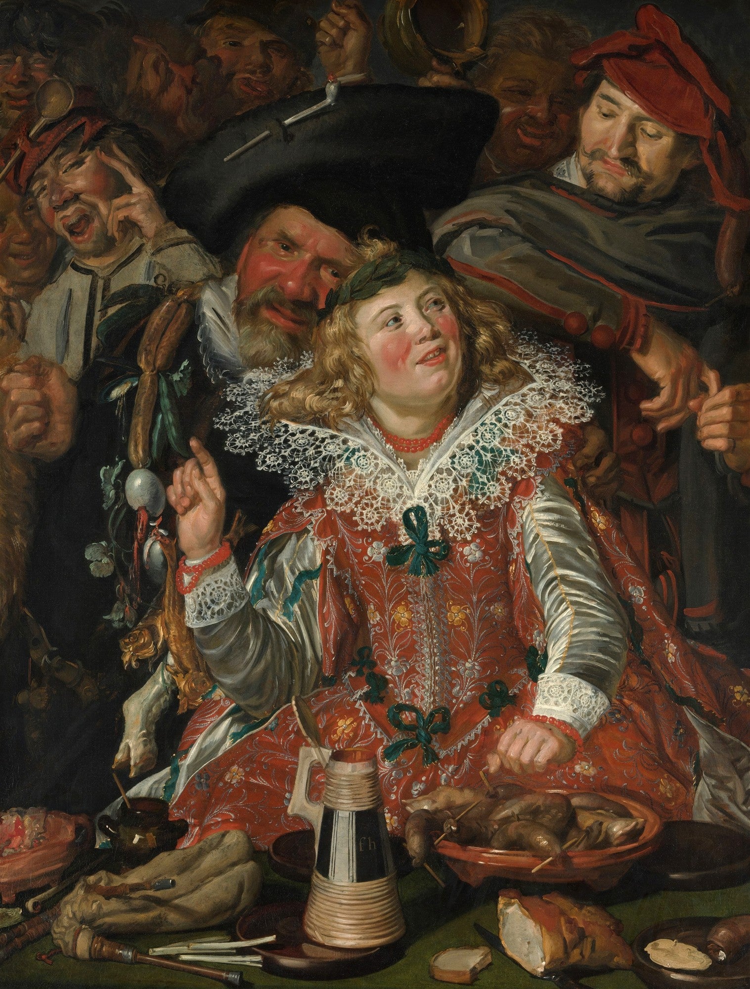 Quadro decorativo com uma cena de banquete barroco, mostrando várias figuras rindo e celebrando, com destaque para uma mulher de vestido vermelho e renda e um homem de chapéu preto e barba avermelhada. Objetos como jarra, comida e instrumentos musicais compõem a cena festiva. Obra de Frans Hals, com um toque de humor e espontaneidade.