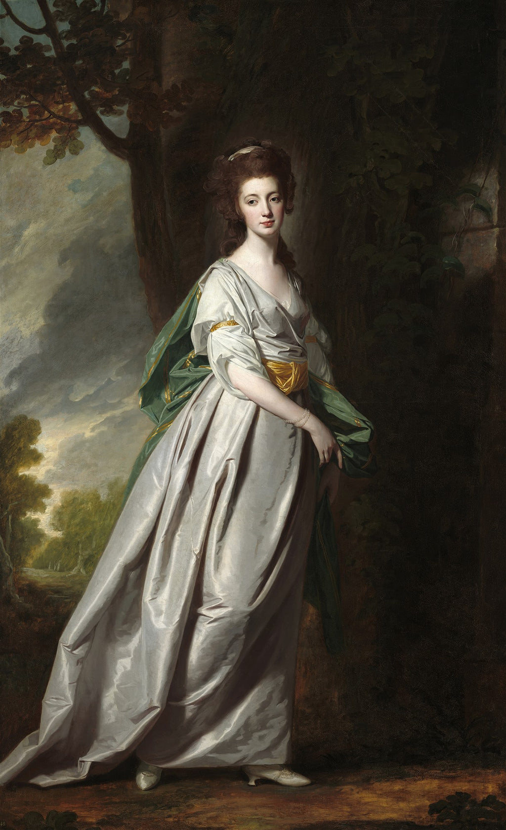 Retrato de corpo inteiro de uma dama do século XVIII, com vestido cinza-prateado e manto verde, em um cenário de floresta escura, pintado por George Romney.