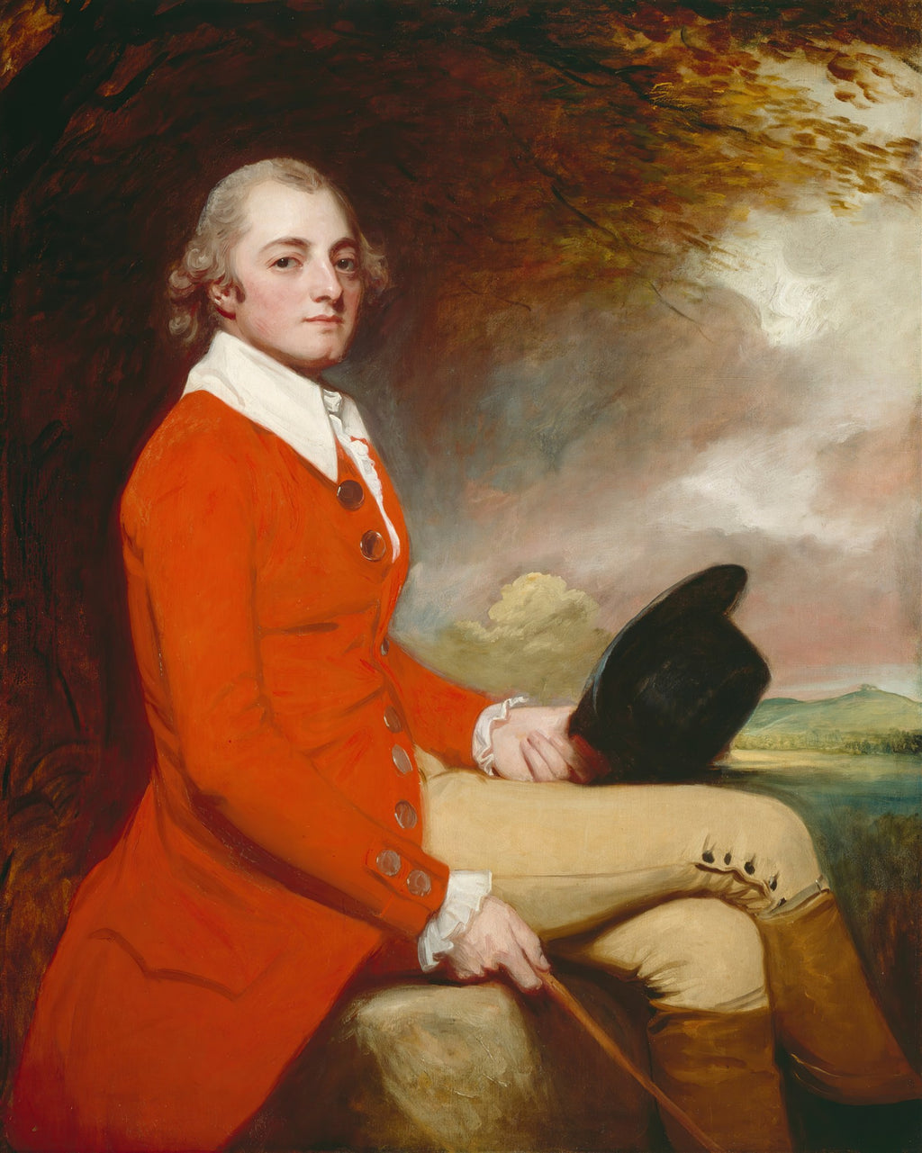 Retrato de um cavalheiro do século XVIII pintado por George Romney, vestindo um casaco vermelho vivo e calças claras, sentado com um chapéu na mão, com um fundo de paisagem nublada e árvores.