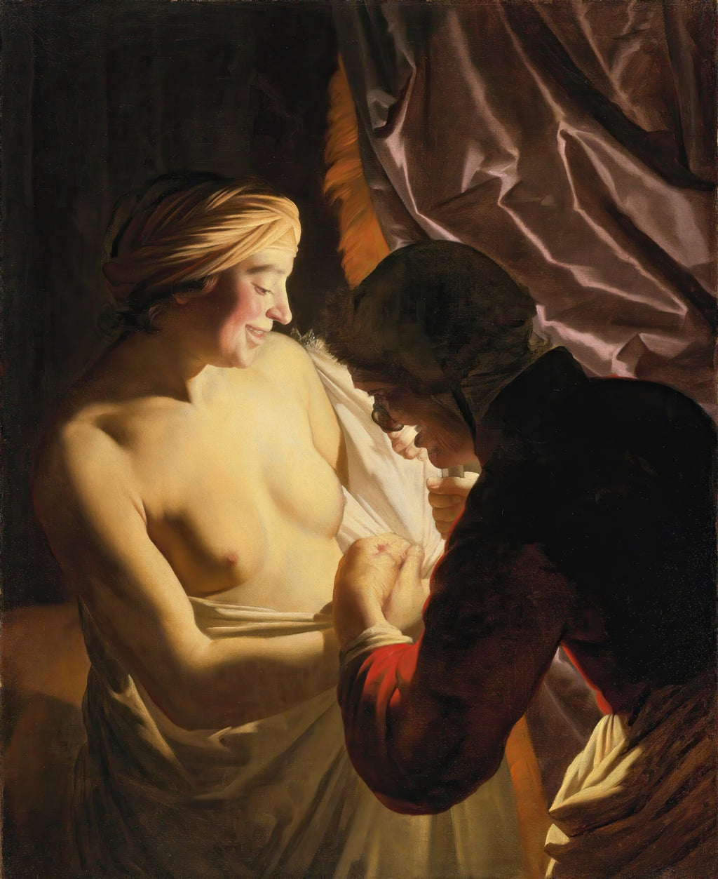 Quadro decorativo "A Velha e a Jovem" de Gerard van Honthorst, mostrando uma mulher jovem seminu, sorrindo, sendo auxiliada por uma figura mais velha em um cenário escuro com iluminação dramática.