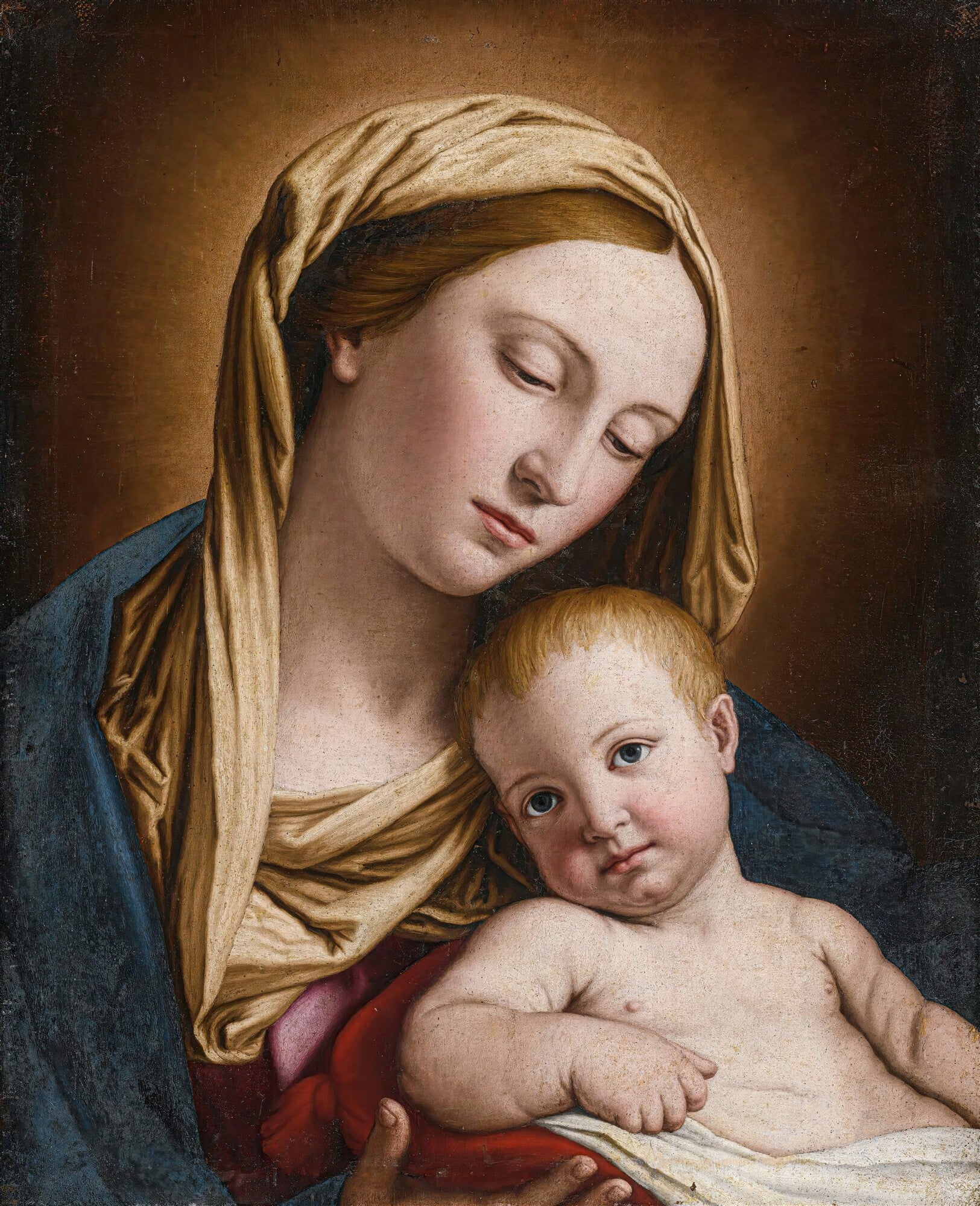 Pintura clássica da Madonna e o Menino por Sassoferrato, com Maria em um manto azul e dourado, segurando o Menino Jesus em seu colo. A luz suave ilumina seus rostos serenos.