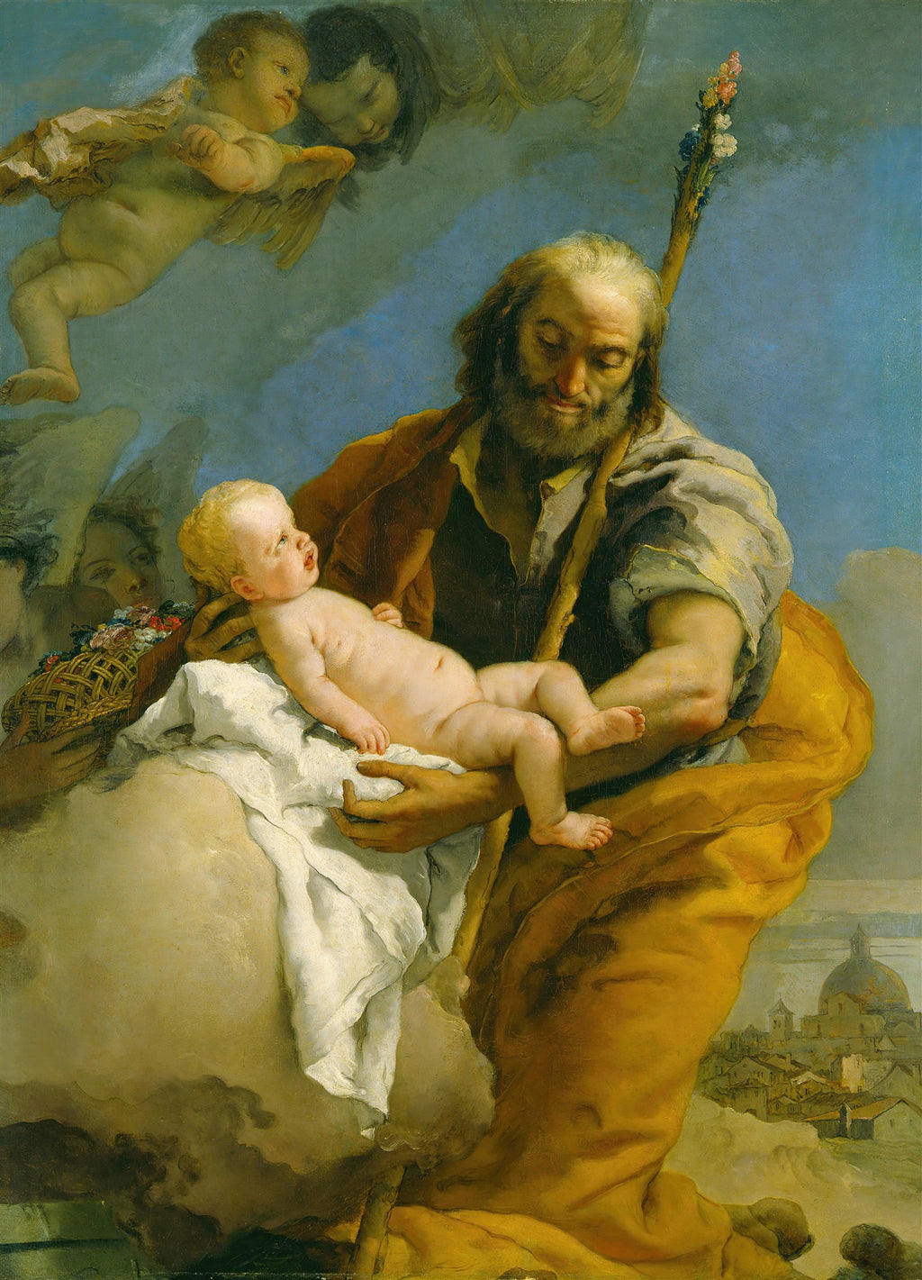 Pintura a óleo de Giovanni Battista Tiepolo mostrando São José segurando o Menino Jesus, com anjos e querubins flutuando ao redor em um céu azul. São José tem barba e veste túnica amarela e marrom, com um bastão florido. O Menino Jesus é um bebê nu com cabelos loiros. A cena é celestial, com nuvens brancas e uma cidade ao fundo.