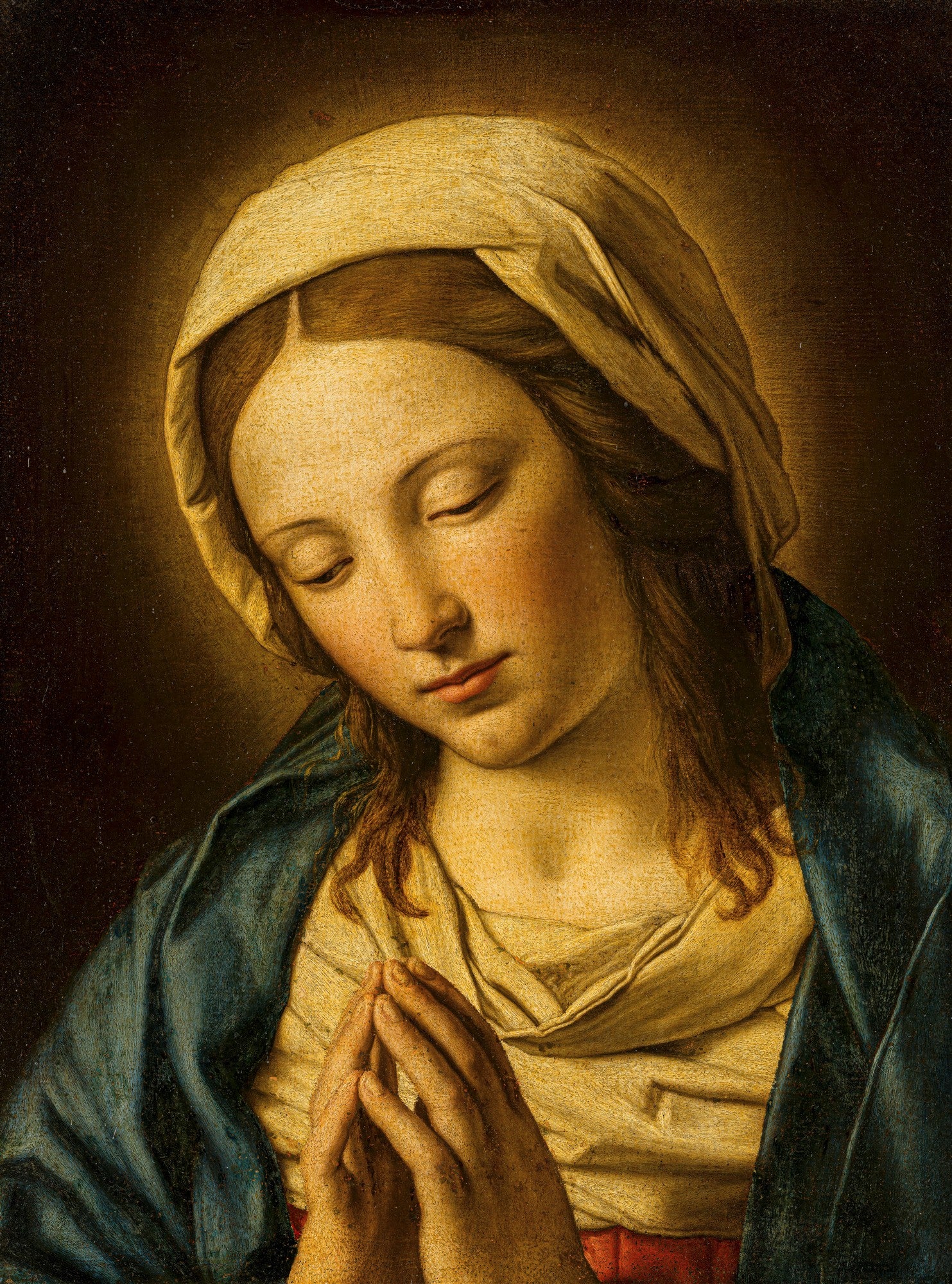 Quadro decorativo da Madonna em Oração, por Sassoferrato, mostrando o rosto sereno e as mãos juntas em prece da Virgem Maria, com um halo sutil em tons dourados ao redor da cabeça, vestindo um manto azul e túnica clara.