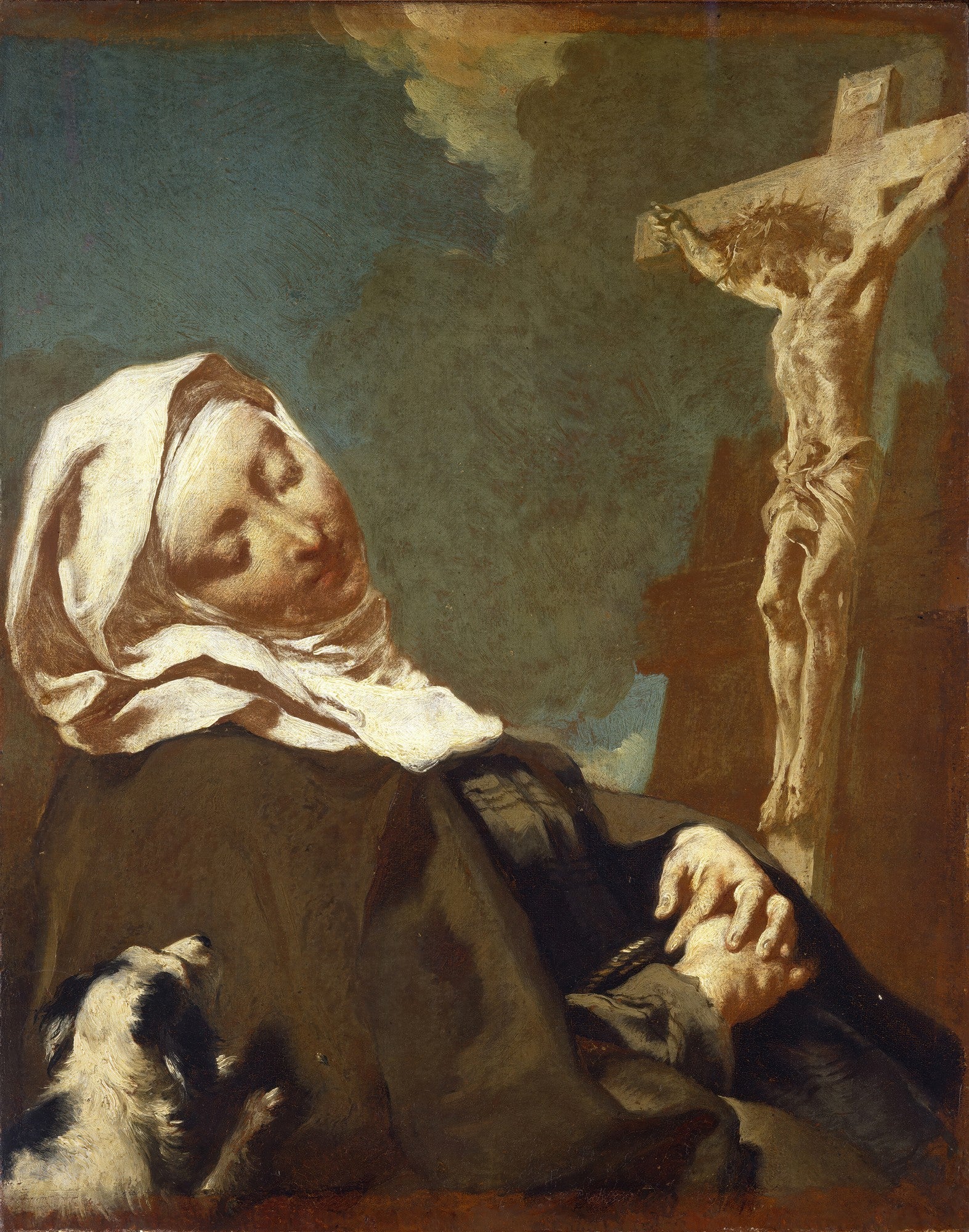 Pintura a óleo de Giovanni Battista Piazzetta, "A Morte de São José", retratando uma figura com vestes escuras e touca branca, deitada e com as mãos postas, em contemplação a um crucifixo. Um pequeno cachorro branco e preto está próximo à figura. Tons escuros predominam, com iluminação dramática.