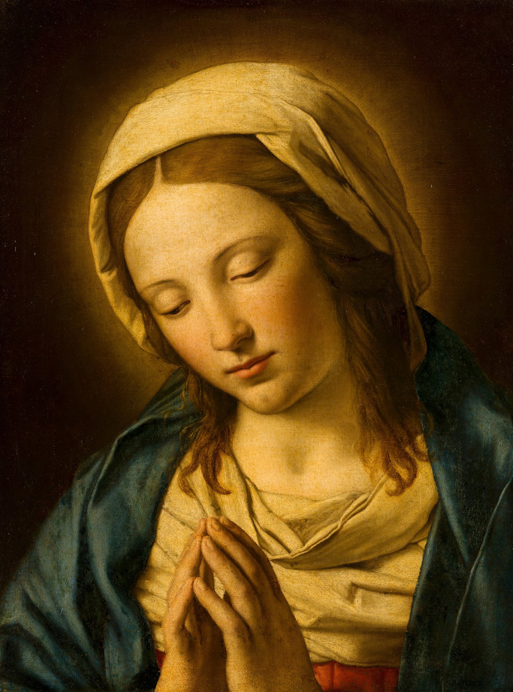 Quadro decorativo "A Virgem em Oração" de Sassoferrato, representando a Virgem Maria com o rosto inclinado e olhos fechados em oração, com as mãos postas, em tons de azul, amarelo e marrom.