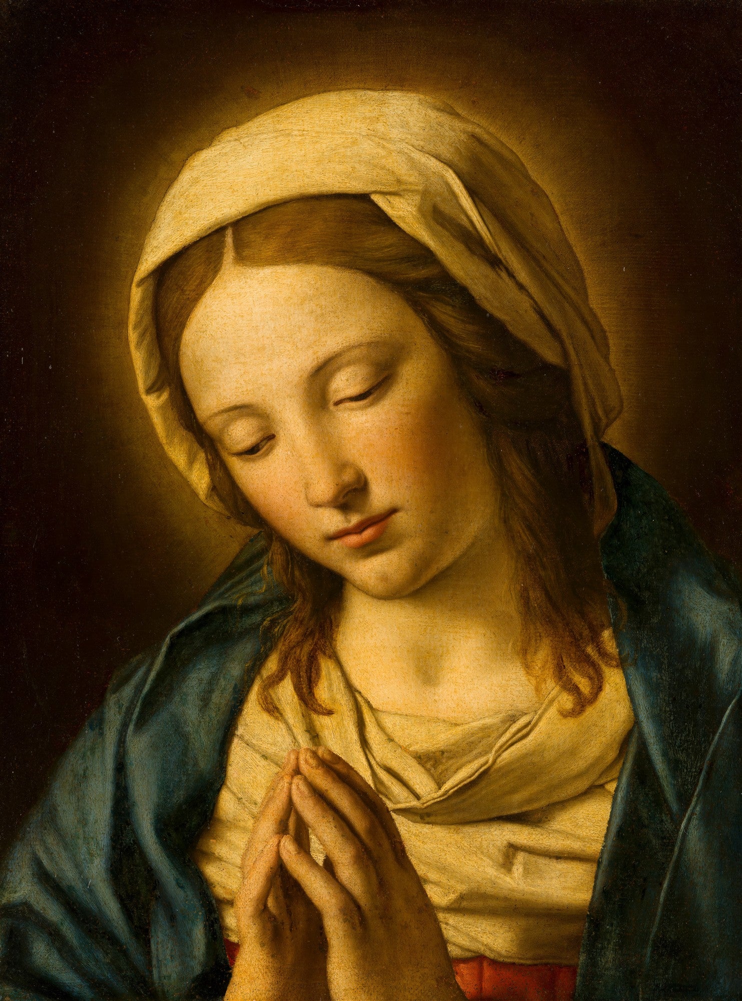 Quadro decorativo "A Virgem em Oração" de Sassoferrato, representando a Virgem Maria com o rosto inclinado e olhos fechados em oração, com as mãos postas, em tons de azul, amarelo e marrom.