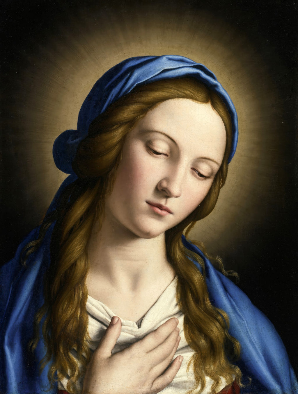 Quadro decorativo da Virgem Maria em oração, de Sassoferrato, com manto azul e expressão serena, olhos baixos e mão sobre o peito, em estilo barroco.