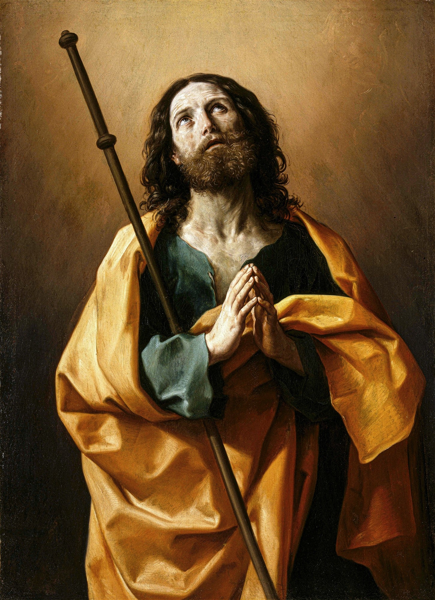 Pintura a óleo de Guido Reni retratando São José com barba e cabelos longos, olhando para cima em oração, com as mãos postas e uma túnica dourada.