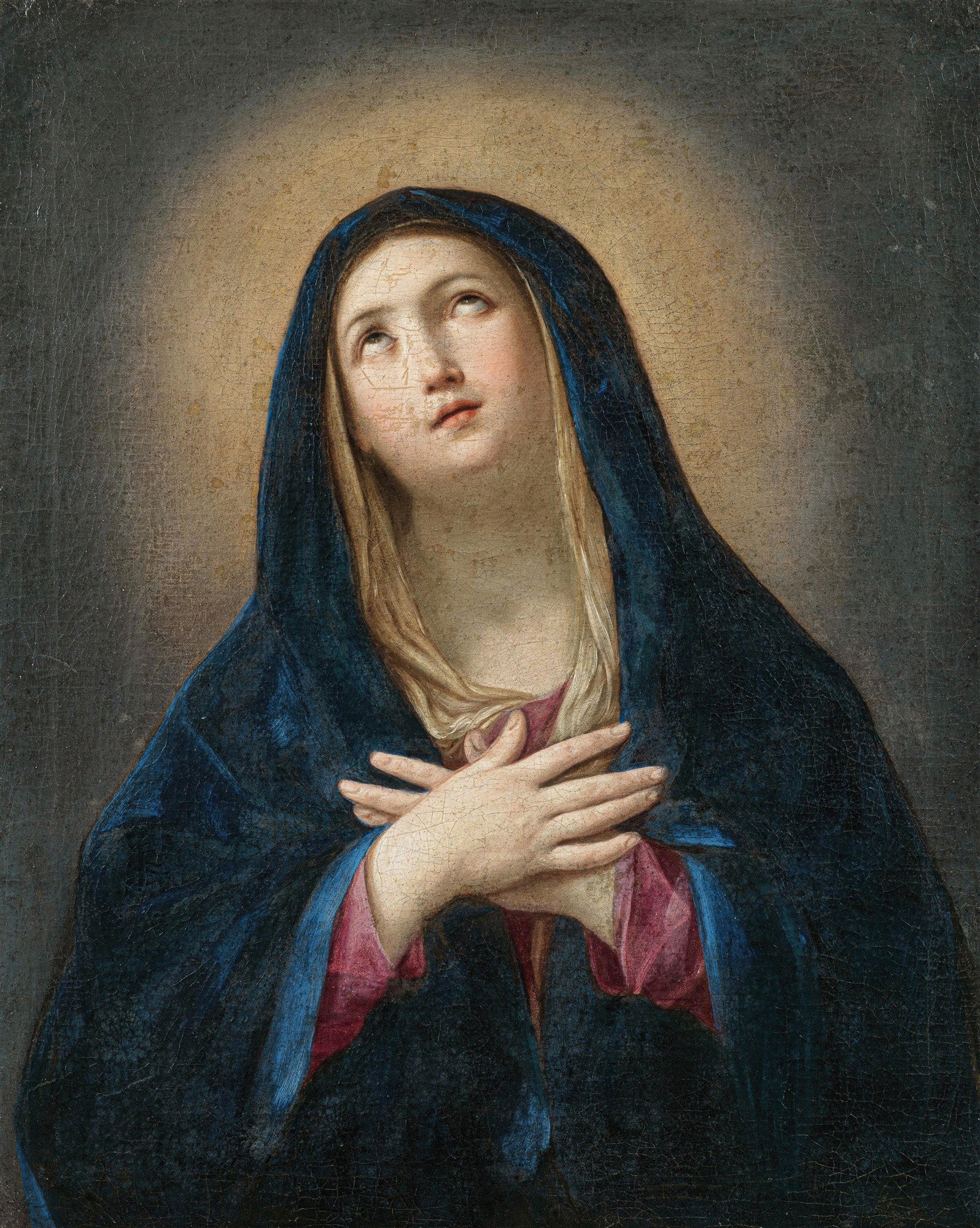 Pintura clássica de Guido Reni, 'Cabeça da Virgem', mostrando uma mulher com véu azul e vestes rosa, olhando para cima com expressão de devoção e mãos cruzadas sobre o peito, em um fundo escuro com halo dourado.