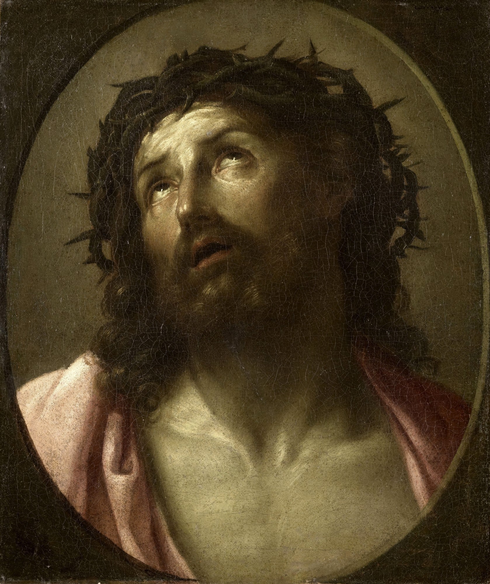 Quadro decorativo com uma representação de Jesus Cristo, coroado de espinhos, olhando para cima com expressão de sofrimento e resignação, em uma pintura oval escura de Guido Reni.