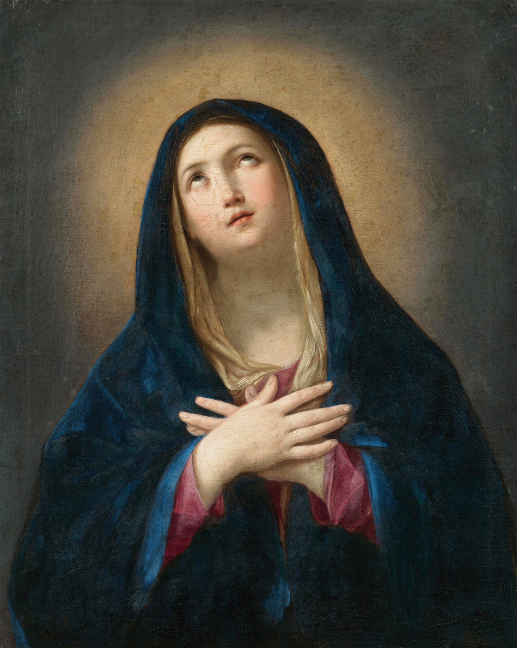 Quadro decorativo da pintura 'A Virgem em Oração' de Guido Reni, mostrando Maria com olhar suplicante para cima e mãos cruzadas sobre o peito, vestindo manto azul e túnica rosa, com auréola suave.