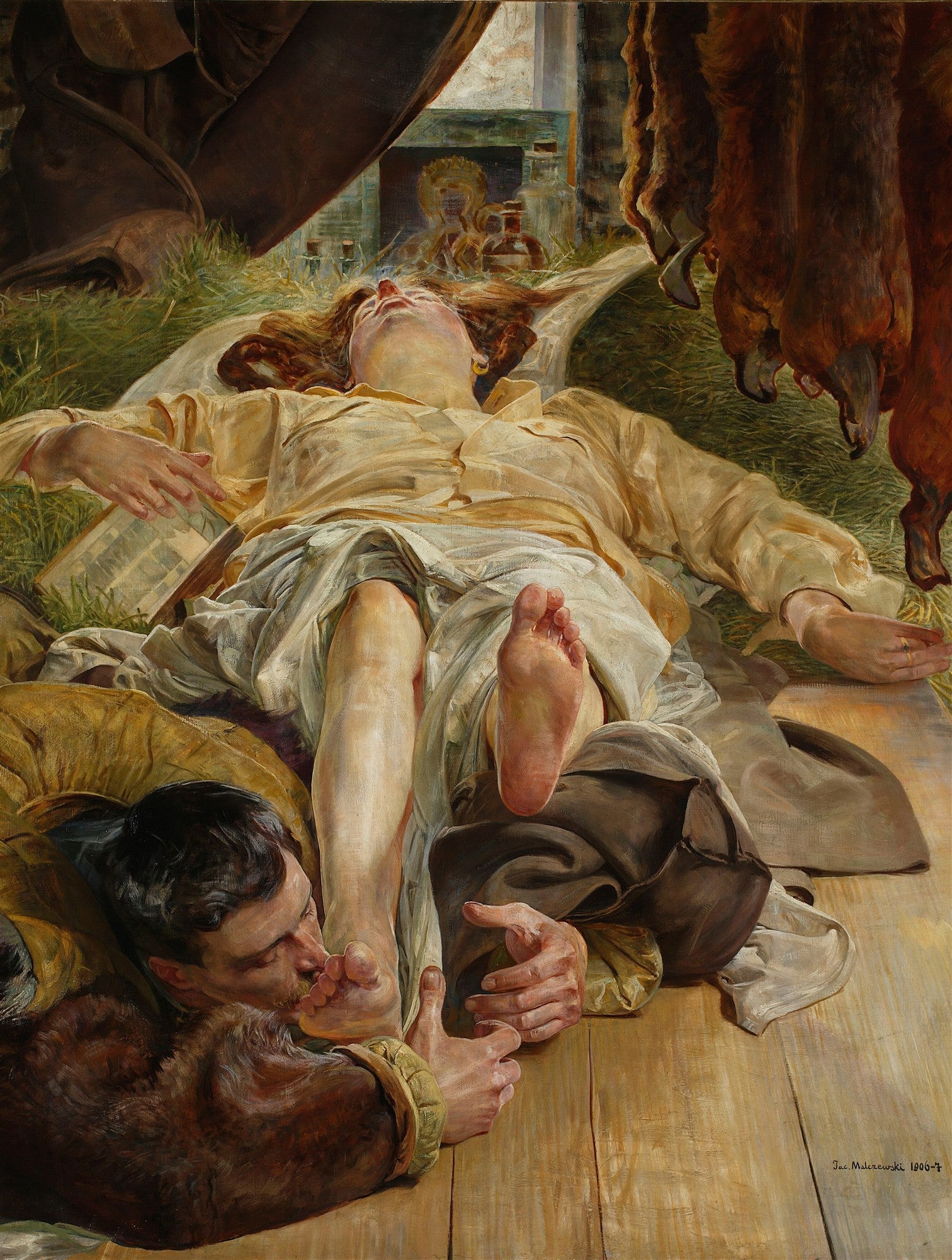 Quadro decorativo 'A Medusa' de Jacek Malczewski, exibindo uma mulher deitada com expressão de êxtase ou sofrimento, e um homem beijando seus pés, em uma composição de cores terrosas e dramáticas.