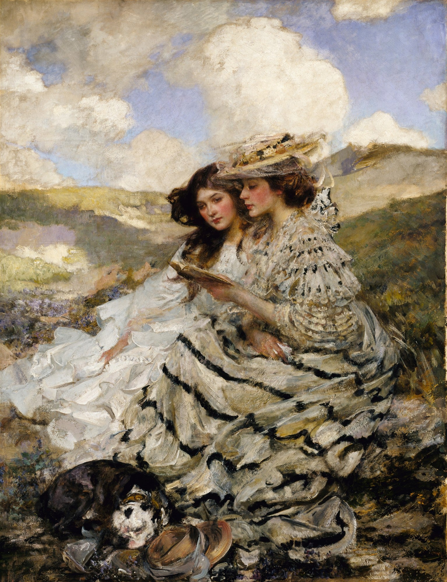 Quadro decorativo de James Jebusa Shannon, 'Duas Mulheres com Livro', retratando duas mulheres jovens sentadas em um campo, lendo um livro, com um cachorro deitado ao lado delas. Céu com nuvens e paisagem ao fundo.