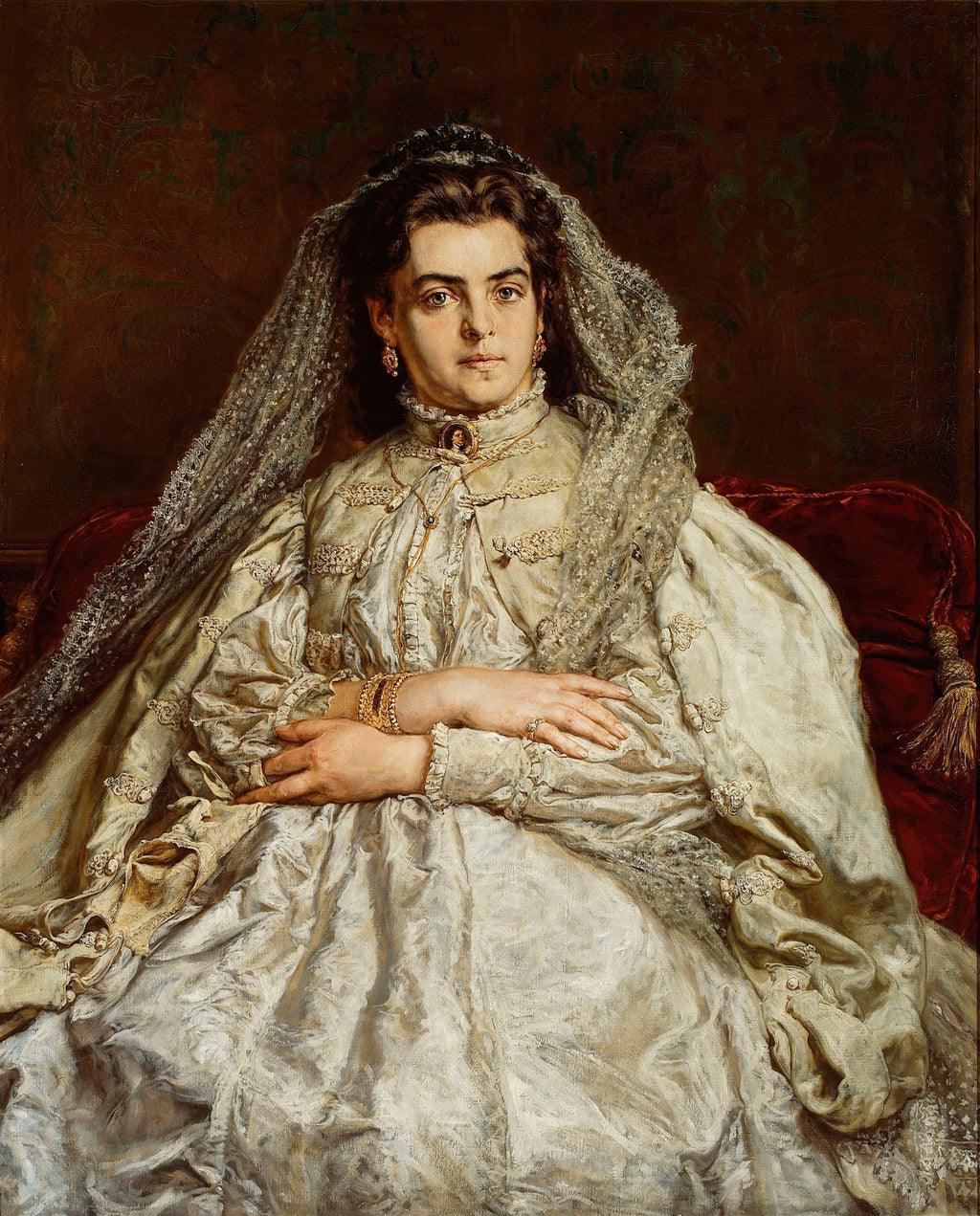 Retrato de uma mulher de cabelo escuro, vestindo um suntuoso vestido de seda creme com renda e véu, sentada em uma poltrona vermelha, com fundo escuro. Atribuído a Jan Matejko.