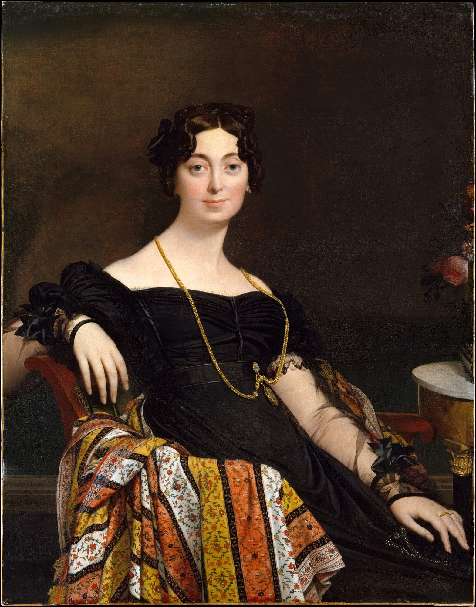 Retrato clássico de uma mulher, a Condessa de Autremencourt, pintado por Jean-Auguste-Dominique Ingres. Ela veste um vestido preto e um xale colorido, sentada em uma poltrona vermelha. A imagem tem um fundo escuro.