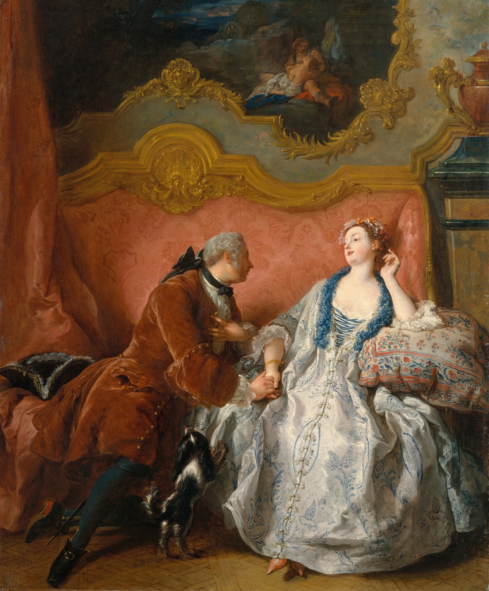 Quadro decorativo 'A Leitura' de Jean François de Troy, mostrando um casal do século XVIII em um interior luxuoso, com o homem ajoelhado segurando a mão da mulher enquanto um cãozinho os observa, e uma cama ornamentada ao fundo.