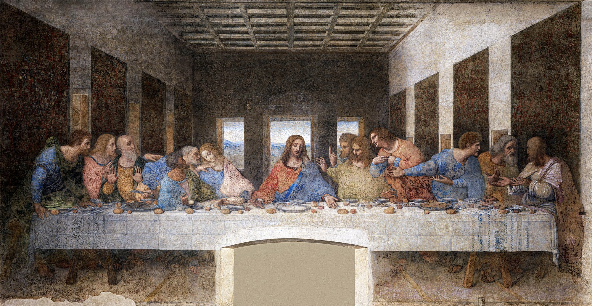 Quadro decorativo A Última Ceia de Leonardo Da Vinci, retratando Jesus e os doze apóstolos sentados à mesa durante a refeição, com expressões variadas de surpresa e consternação, em tons terrosos e azuis.