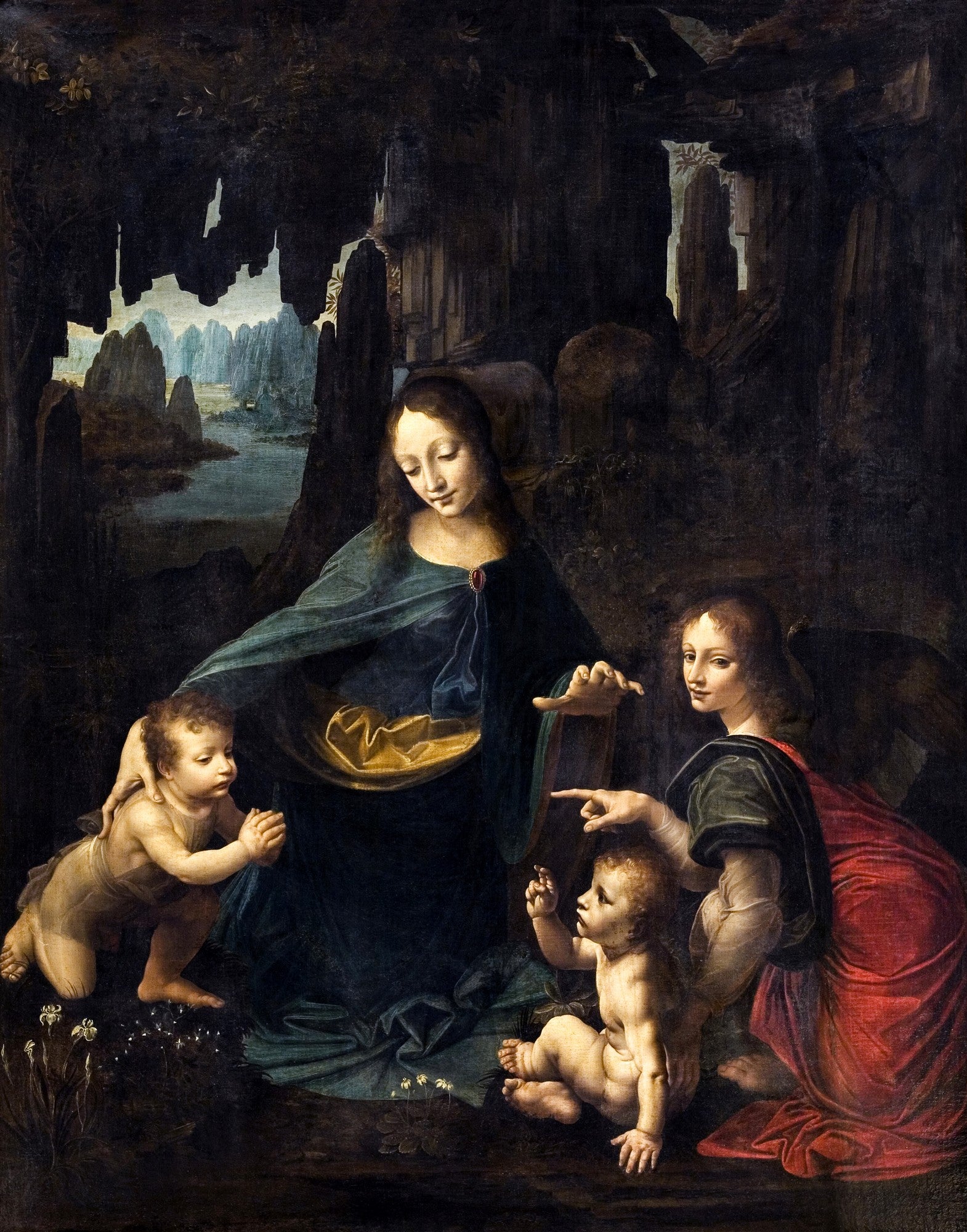 Quadro decorativo 'A Virgem dos Rochedos' de Leonardo Da Vinci, mostrando a Virgem Maria, o Menino Jesus, São João Batista e um anjo em uma gruta rochosa, com paisagem montanhosa ao fundo e a técnica sfumato evidente.