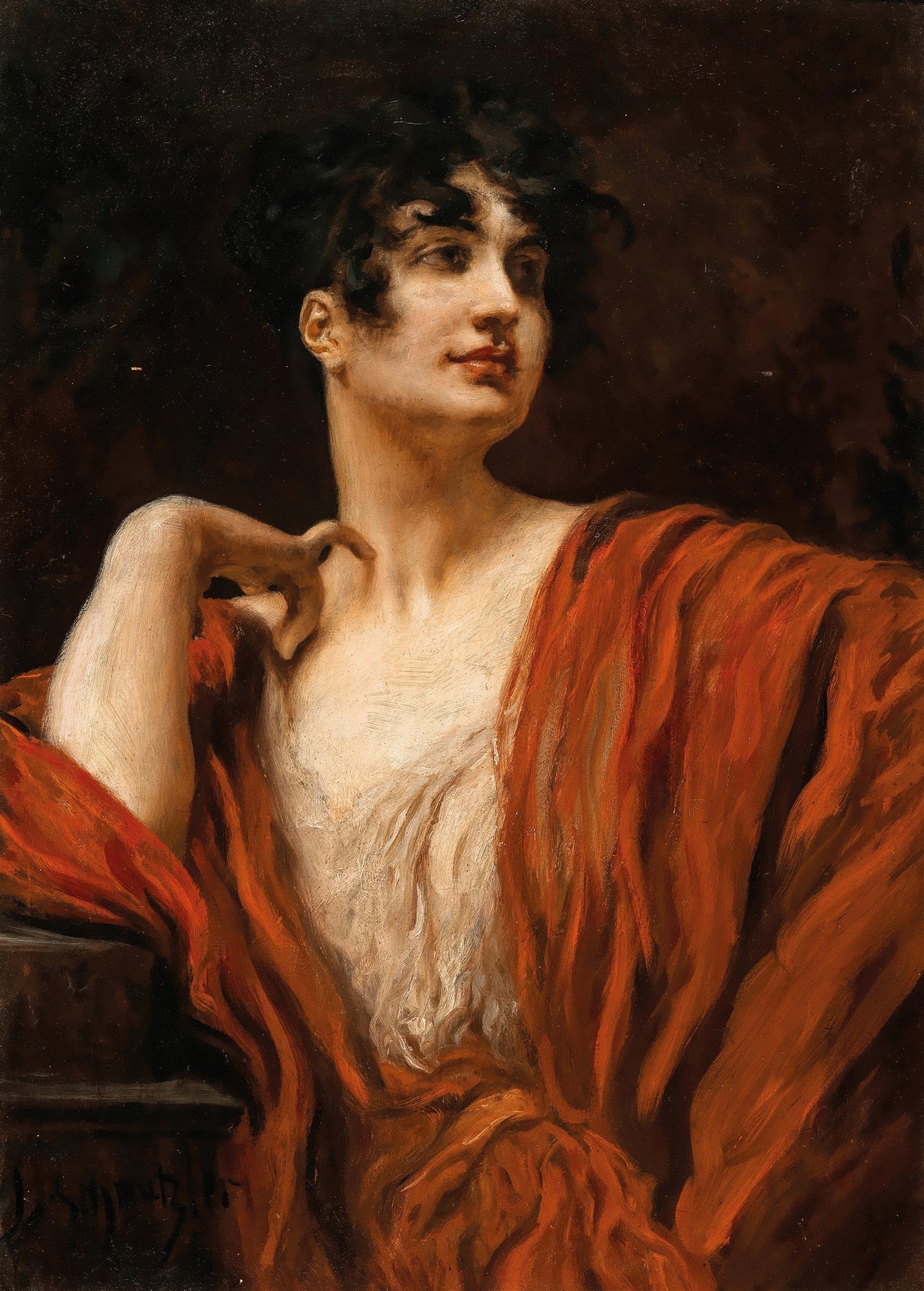 Retrato de uma mulher jovem de perfil, com cabelos escuros e cacheados, vestindo um manto vermelho vibrante que revela parte do seu colo. A iluminação é dramática, com fundo escuro.