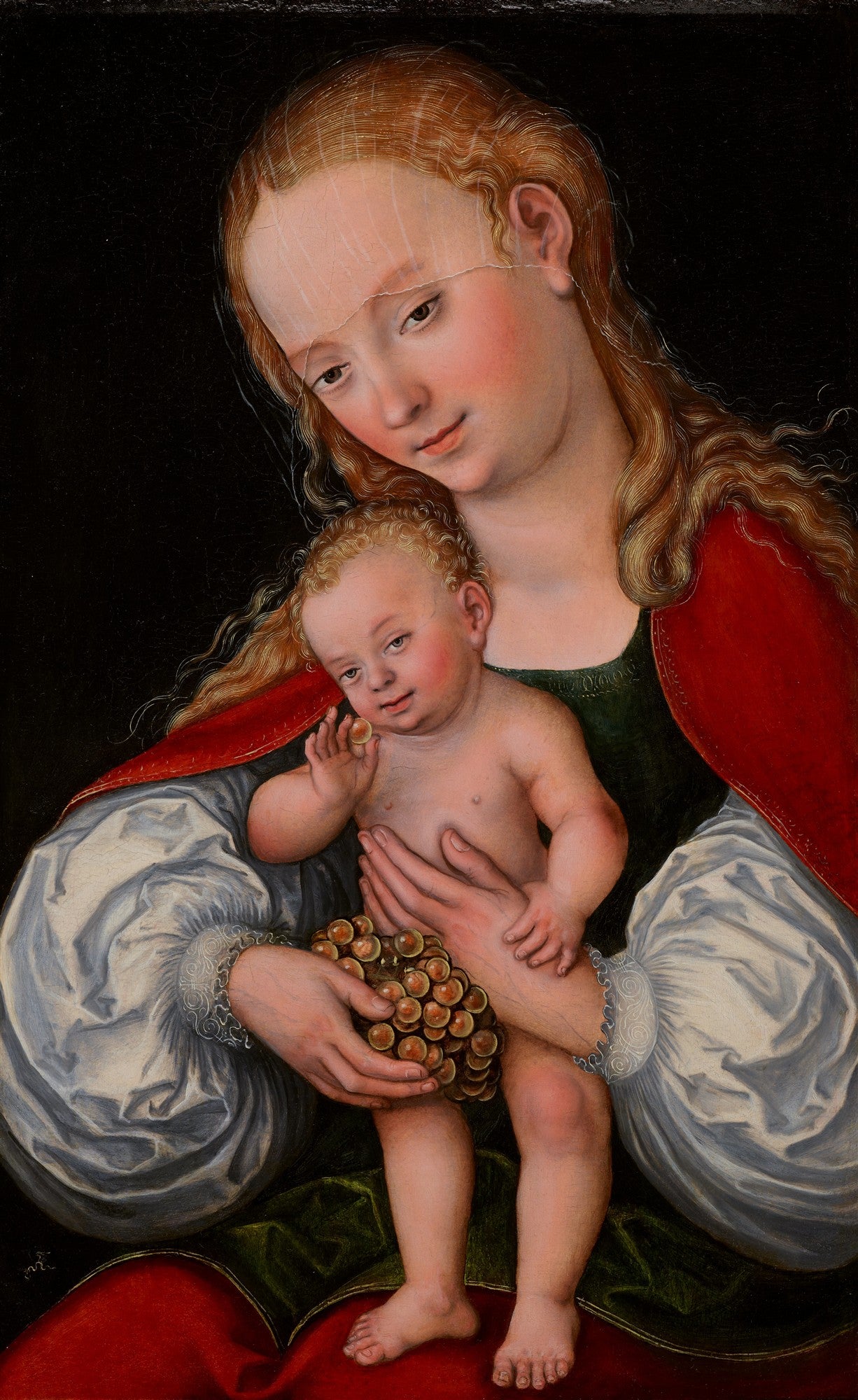 Pintura renascentista de uma Madona de cabelos ruivos segurando o Menino Jesus, que segura um cacho de uvas. Fundo escuro.