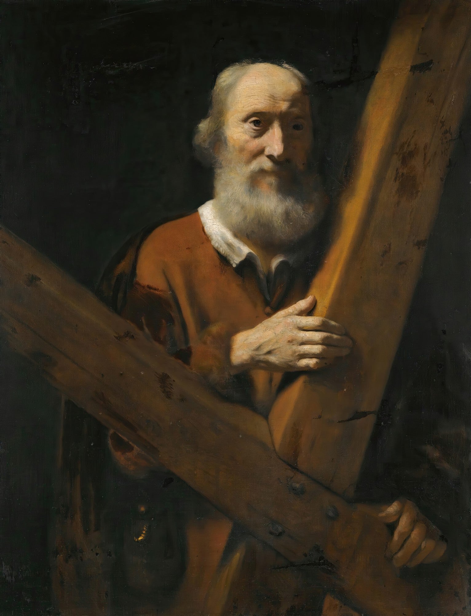 Retrato de um homem idoso com barba branca, segurando uma grande cruz de madeira. A obra apresenta um claro-escuro dramático, com o rosto do homem iluminado em contraste com um fundo escuro. Ele veste uma túnica marrom-avermelhada. A imagem é um exemplo da pintura barroca holandesa.