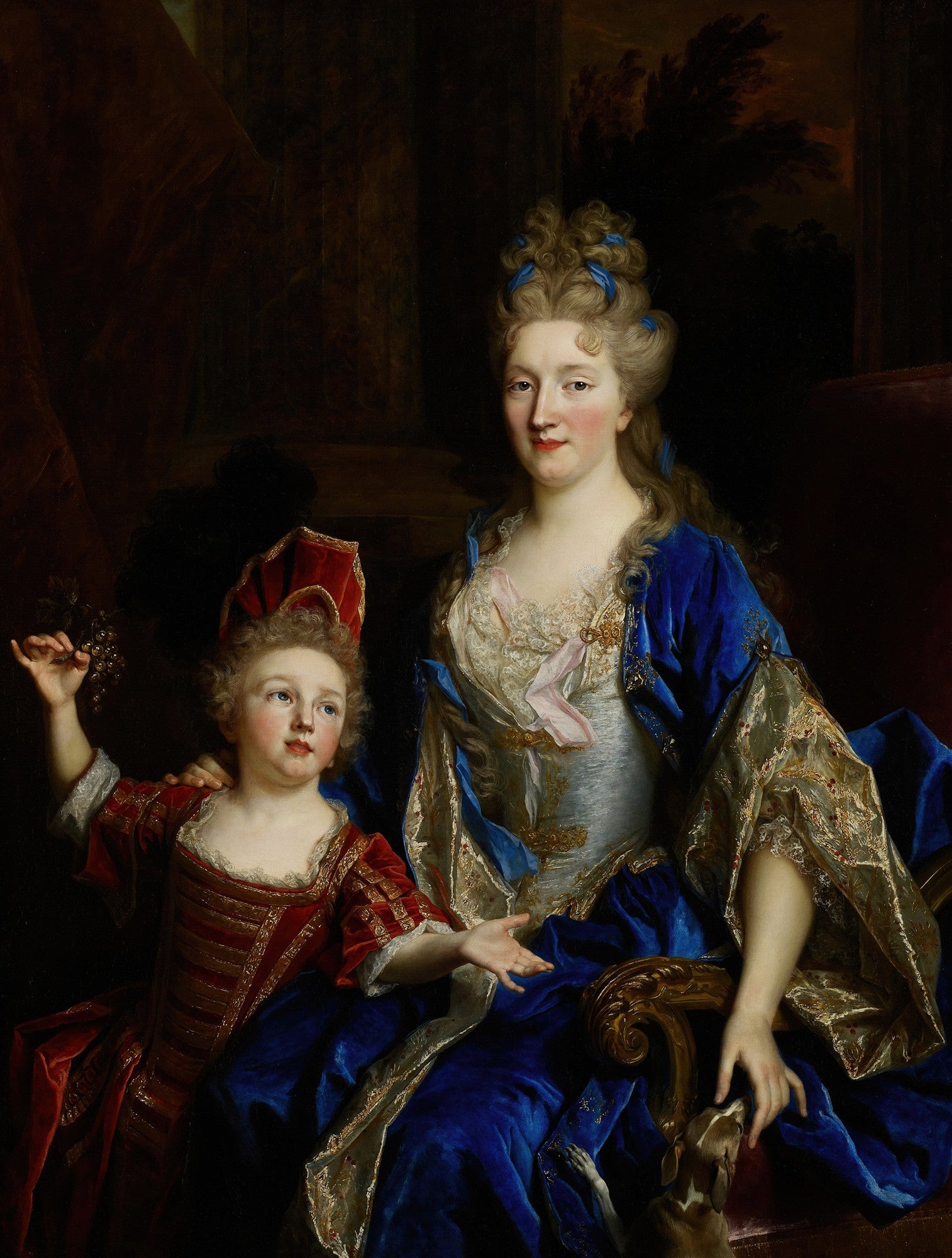 Retrato de uma dama com um vestido azul e seu filho em um vestido vermelho, ambos com vestes luxuosas e expressões serenas. Obra de Nicolas de Largillière.
