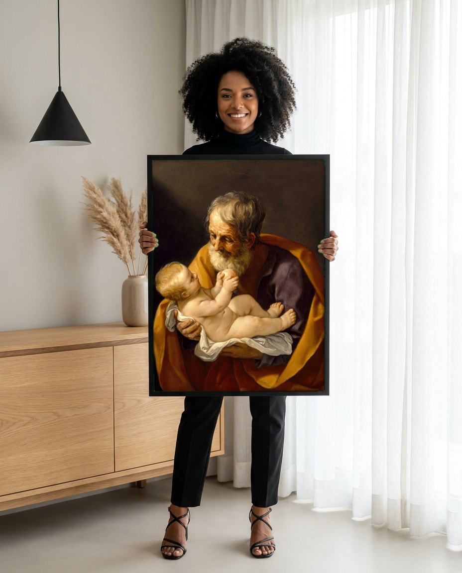 Quadro Decorativo São José com o Menino Jesus - Guido Reni | modelo apresentando o quadro emoldurado
