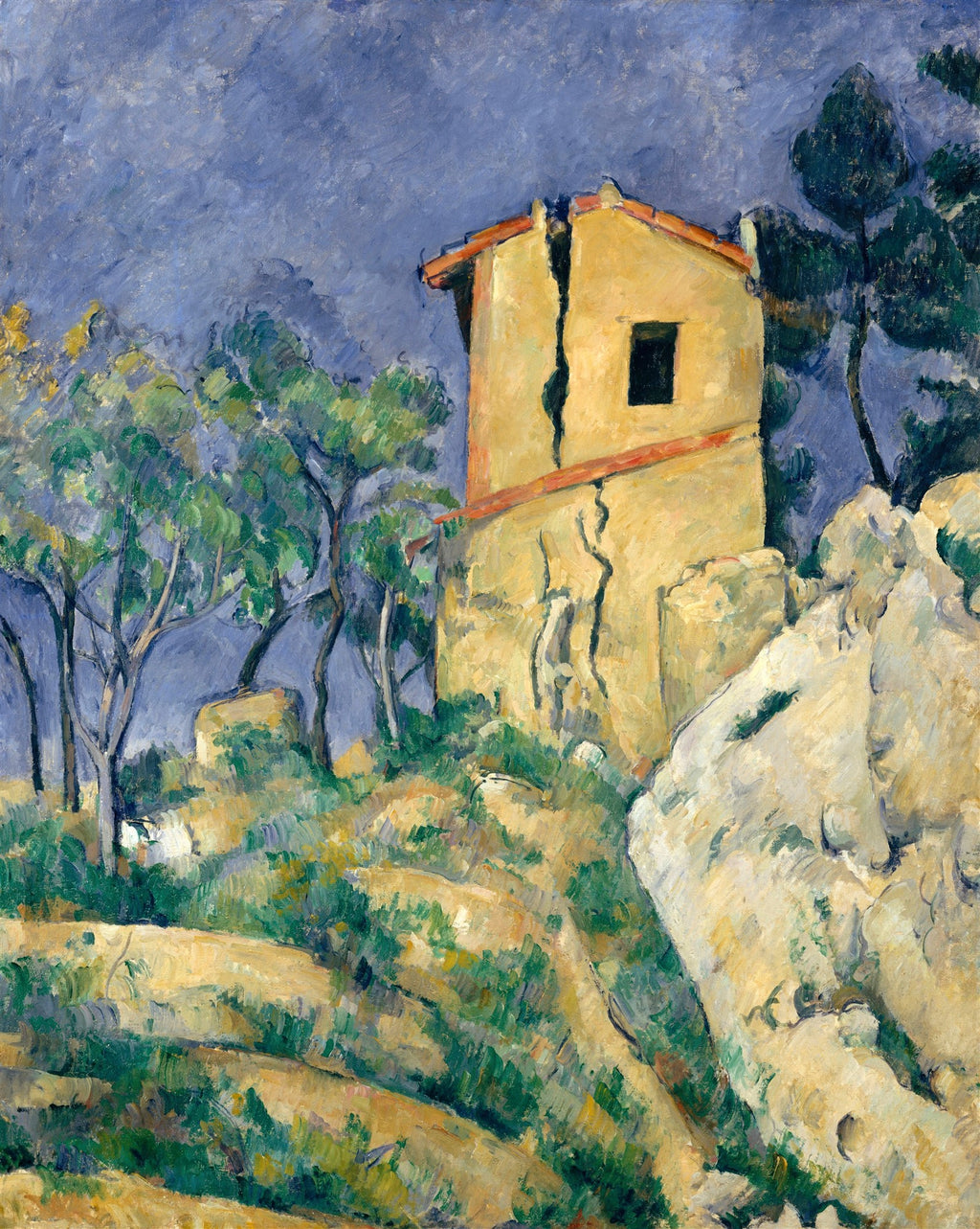 Quadro decorativo 'A Casa Rachada' de Paul Cézanne, exibindo uma casa antiga, amarela e com rachaduras, em meio a uma paisagem rochosa e árvores verdes sob um céu azul-acinzentado.