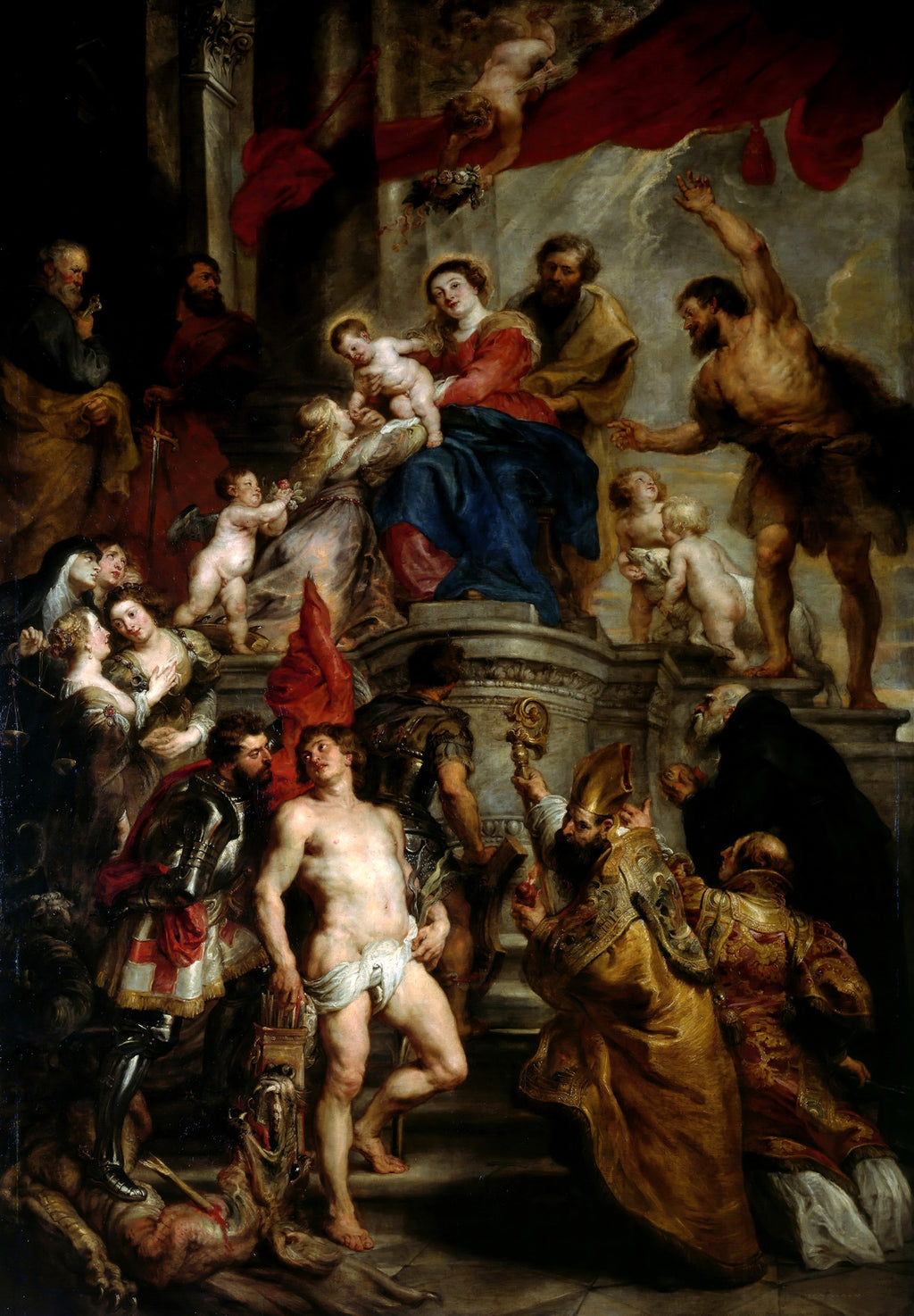 Pintura barroca de Peter Paul Rubens, 'A Família Sacra com São João Batista', mostrando a Virgem Maria, São José, o Menino Jesus e São João Batista, cercados por outras figuras religiosas e anjos em uma cena grandiosa e dramática.