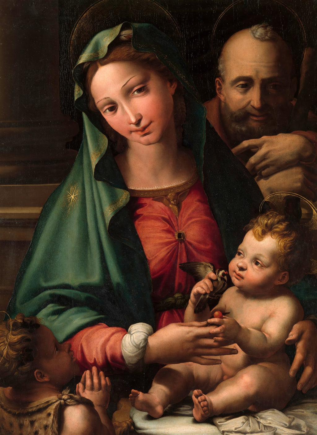 Quadro decorativo da Sagrada Família com Maria, Jesus, São José e São João Batista. Maria veste um manto verde e túnica vermelha, o Menino Jesus segura um pássaro. A pintura tem tons quentes e expressões serenas.