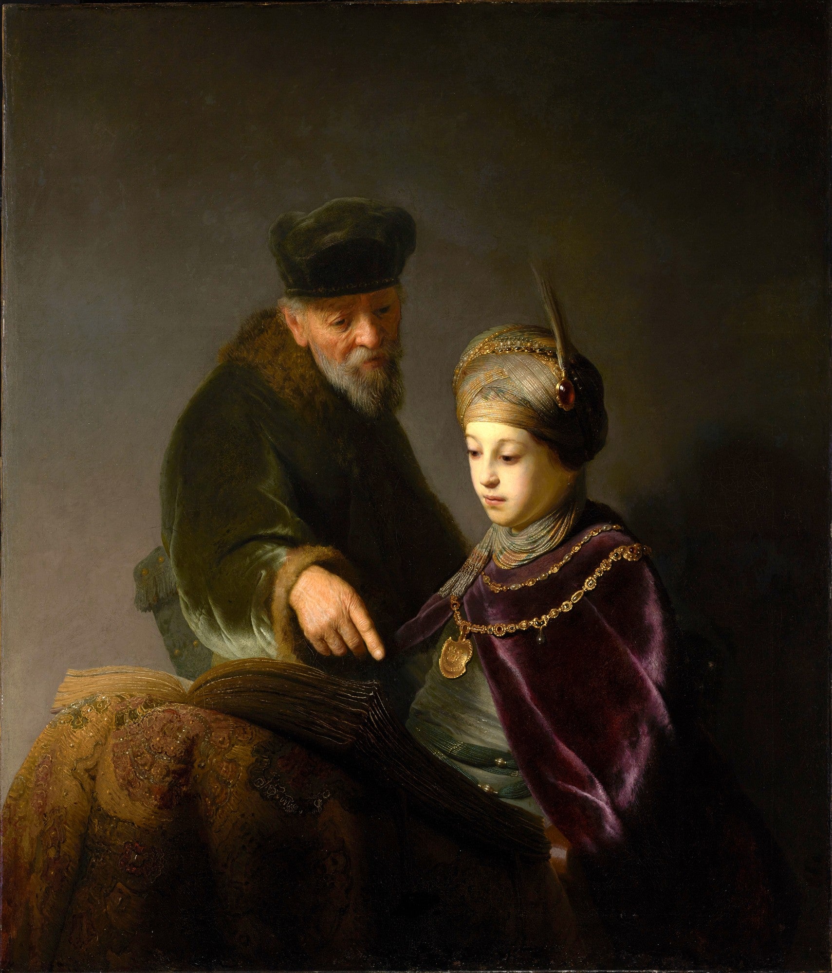 Quadro decorativo com pintura a óleo de Rembrandt, 'O Erudito e seu Aluno', mostrando um homem mais velho com barba ensinando um jovem ricamente vestido, ambos debruçados sobre um livro antigo em uma cena de claro-escuro.