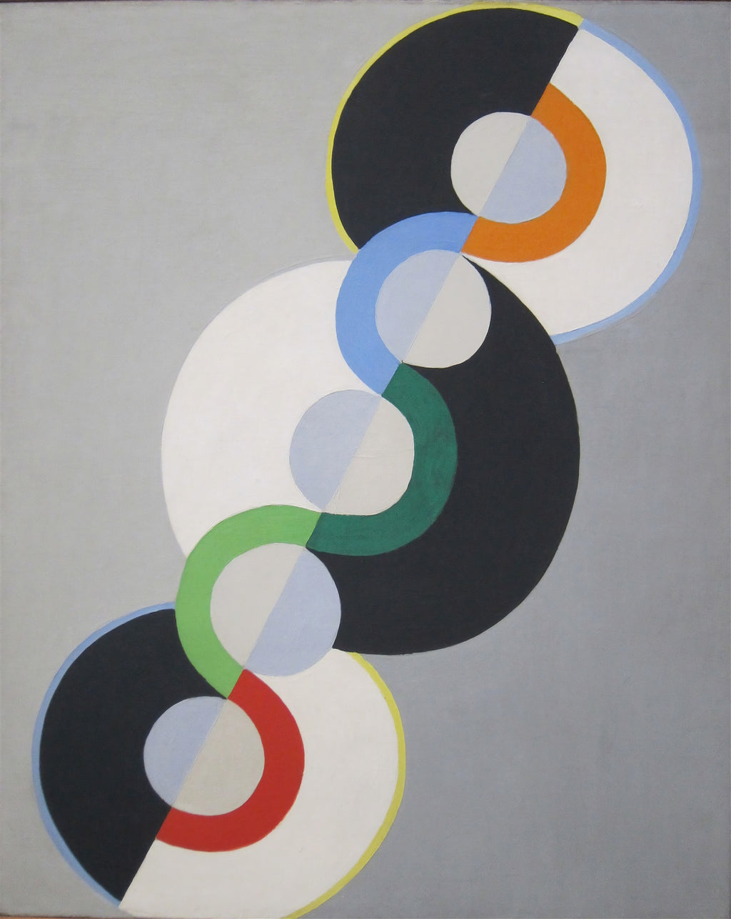 Quadro abstrato de Robert Delaunay com múltiplos círculos concêntricos coloridos (preto, branco, azul, verde, laranja, vermelho) sobre fundo cinza.