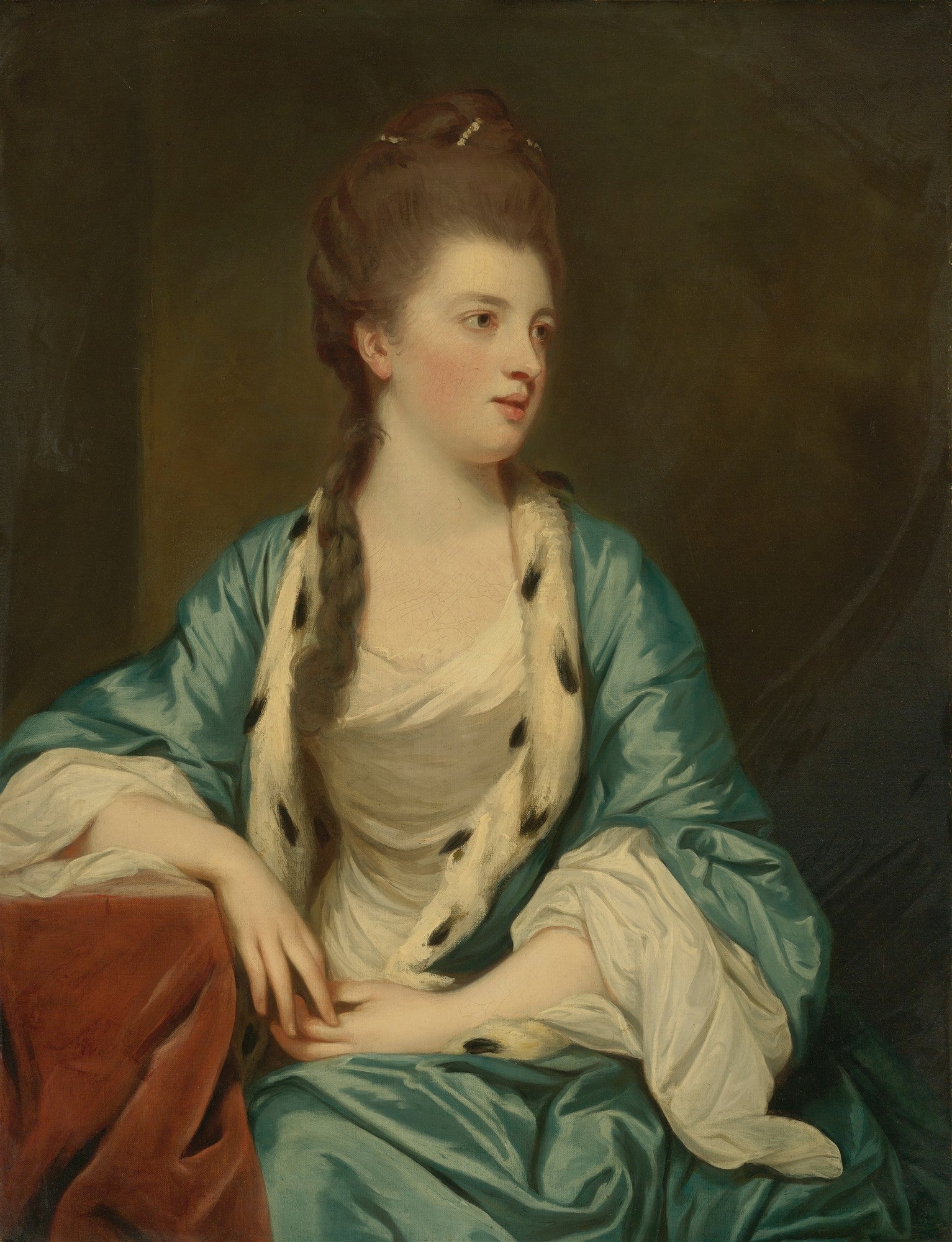 Retrato de Lady Elizabeth Herbert, Condessa de Pembroke, por Sir Joshua Reynolds. Mulher de cabelos castanhos e pele clara, vestindo um robe azul esverdeado adornado com pele branca e manchas pretas. Ela está sentada, com as mãos delicadamente unidas sobre uma mesa coberta por um tecido avermelhado, olhando para o lado direito da tela com uma expressão serena.