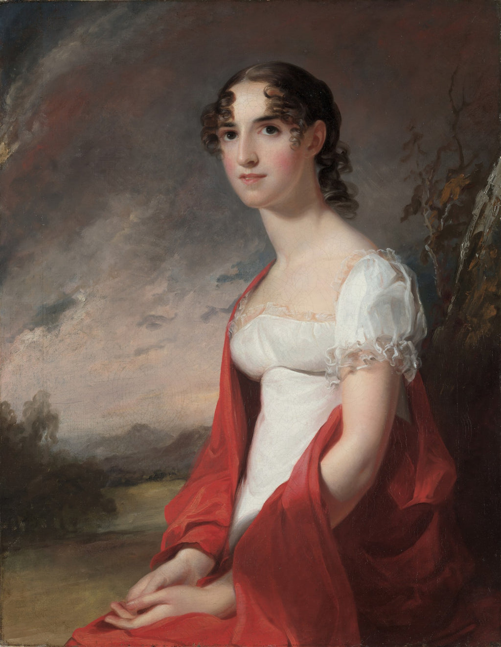 Retrato de uma mulher jovem do século XIX, com cabelo escuro cacheado, vestido branco e xale vermelho vibrante, sentada em frente a uma paisagem nebulosa. Obra atribuída a Thomas Sully.