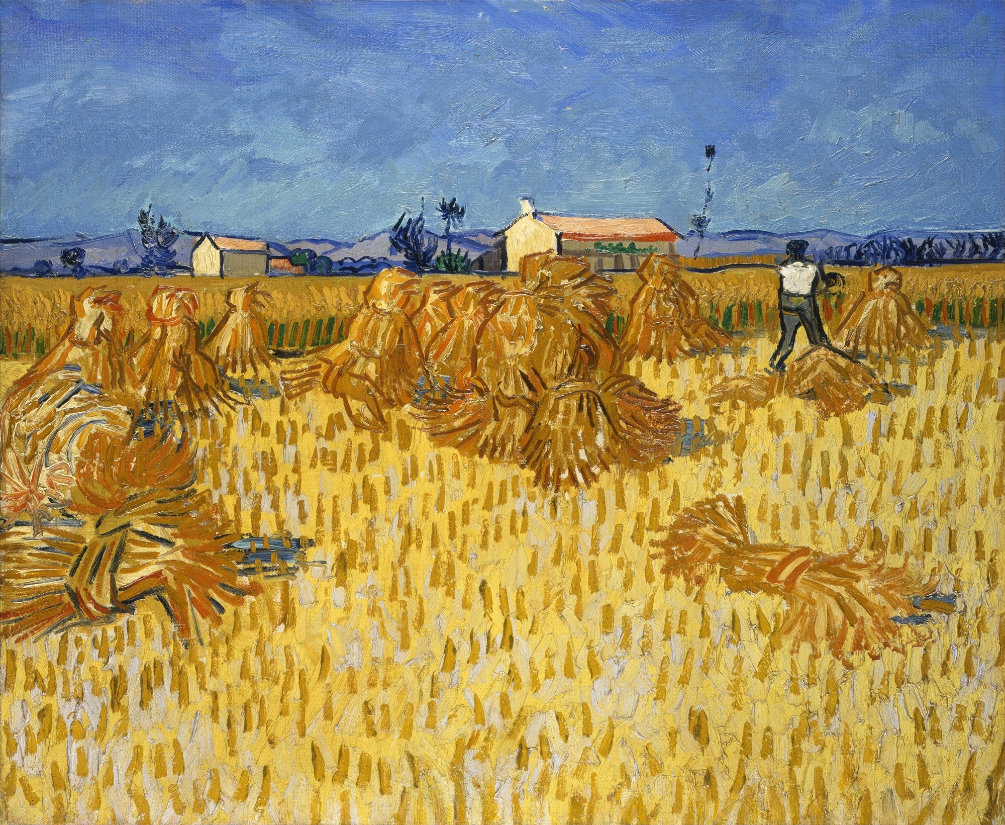 Quadro decorativo com a pintura Campo de Trigo com Ceifeiro de Vincent van Gogh, exibindo um campo dourado de trigo com feixes empilhados, um ceifeiro trabalhando e casas ao fundo sob um céu azul intenso.