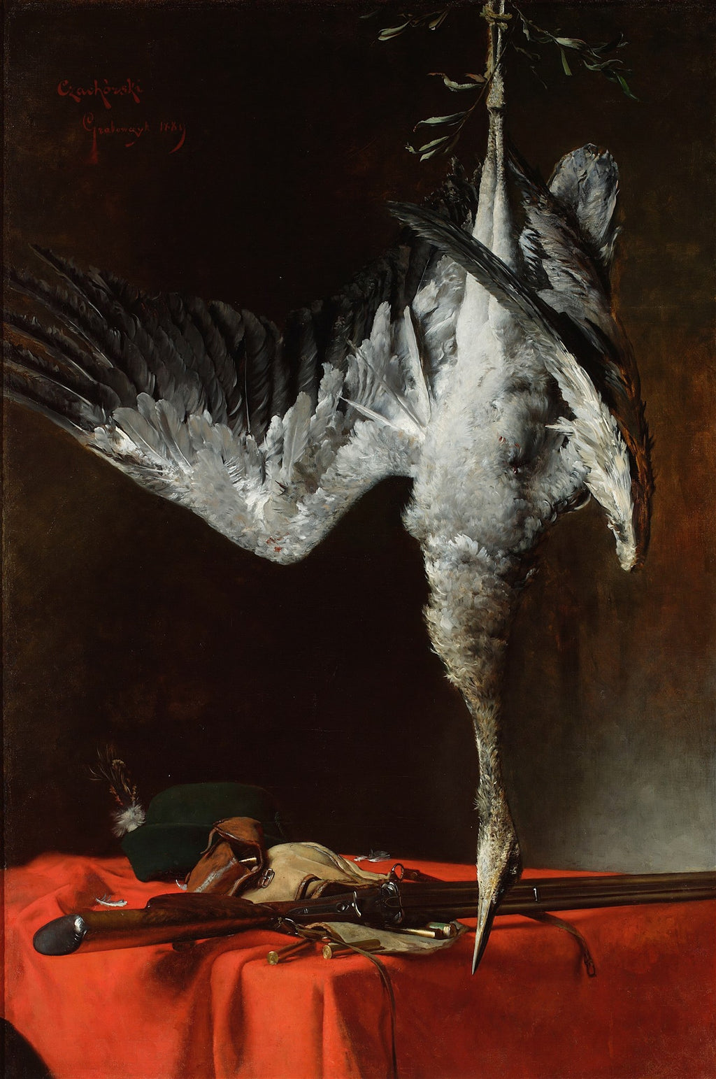 Quadro decorativo mostrando uma natureza-morta com um ganso abatido pendurado, chapéu de caça, espingarda e cartuchos sobre uma toalha vermelha, fundo escuro. Obra de Władysław Czachórski.